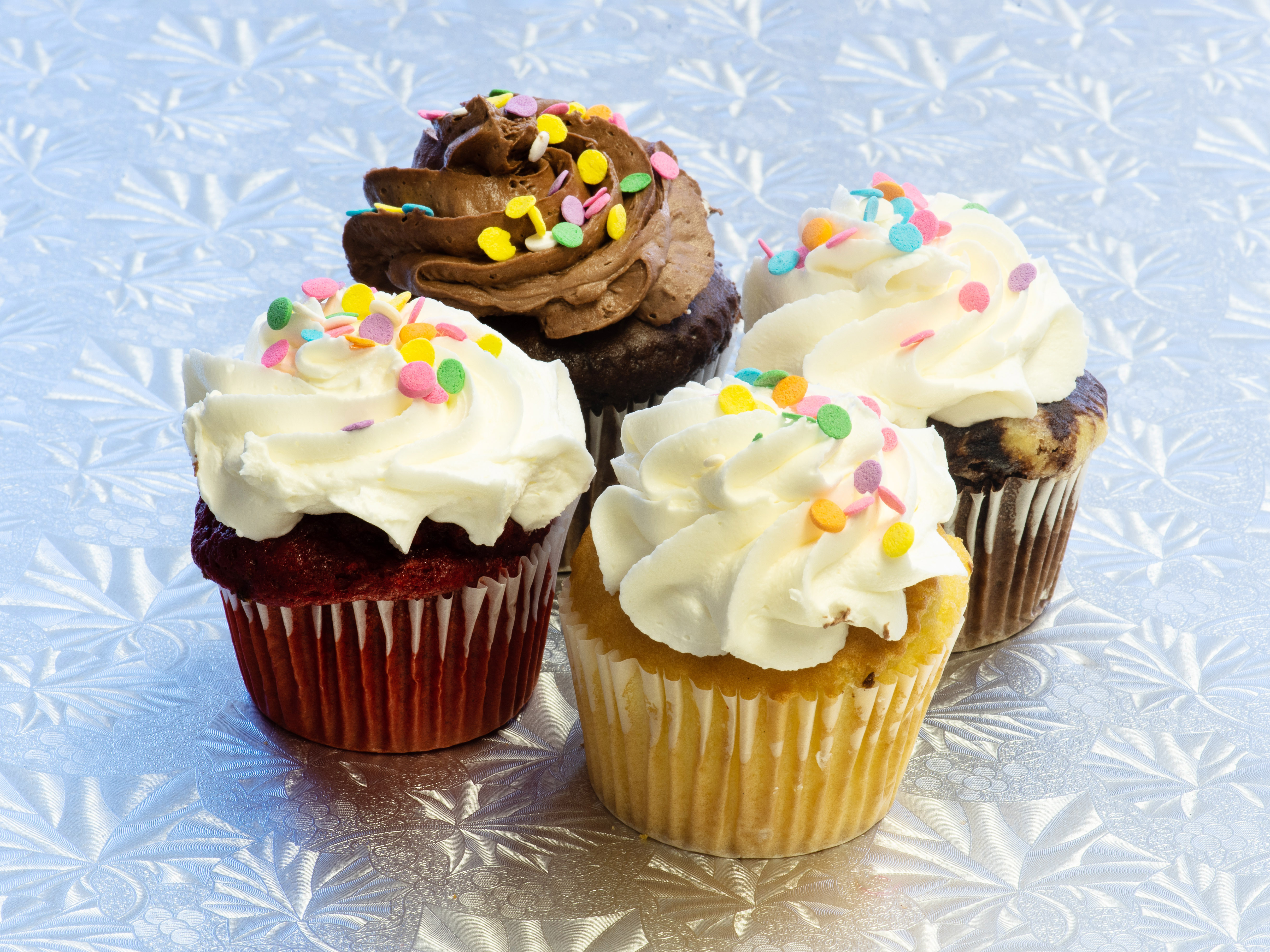 Order 4 Assorted Cupcakes food online from Creative Cakes store, Silver Spring on bringmethat.com