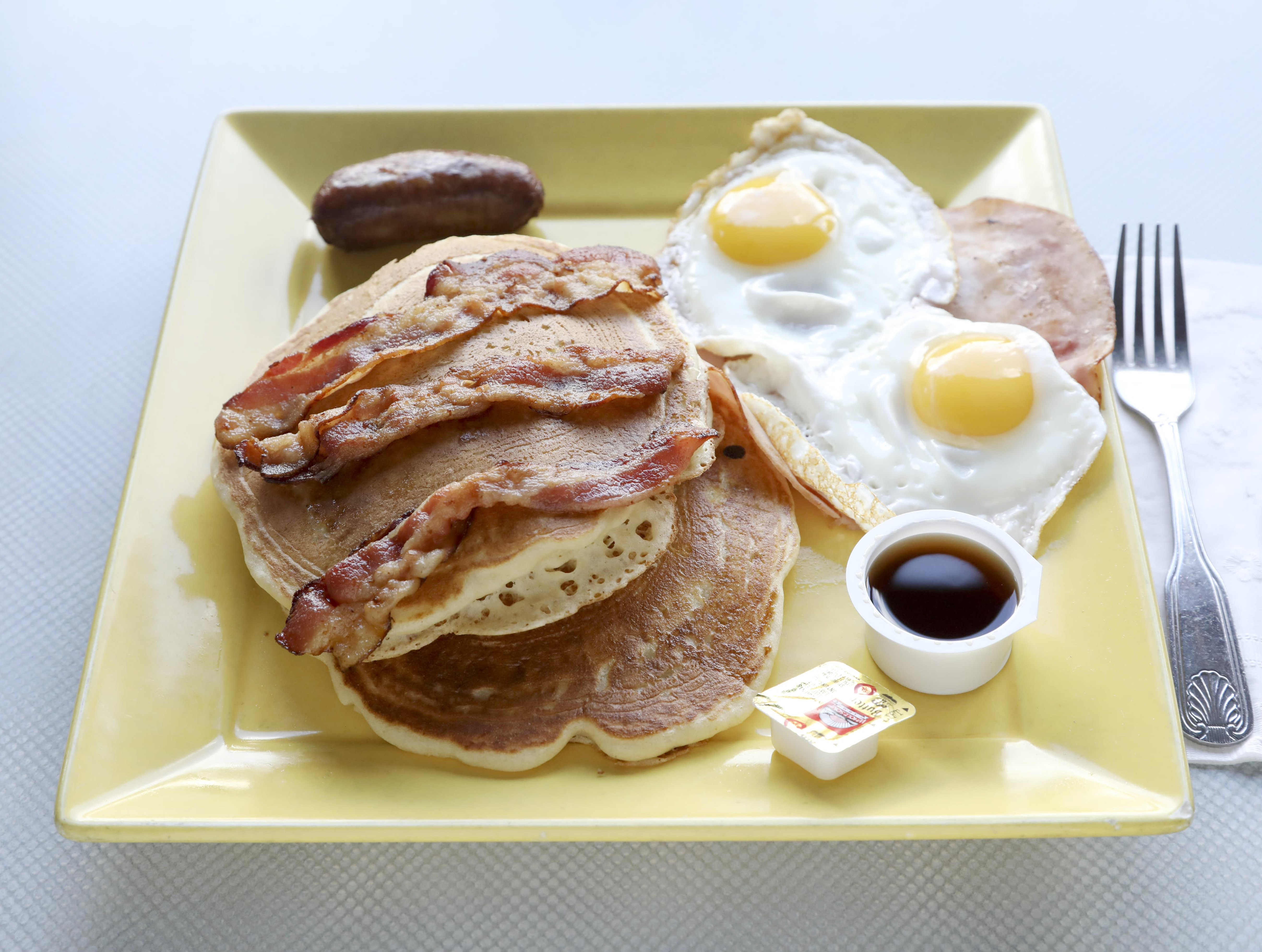 Order Pancakes Deluxe food online from Kellogg's diner store, Brooklyn on bringmethat.com