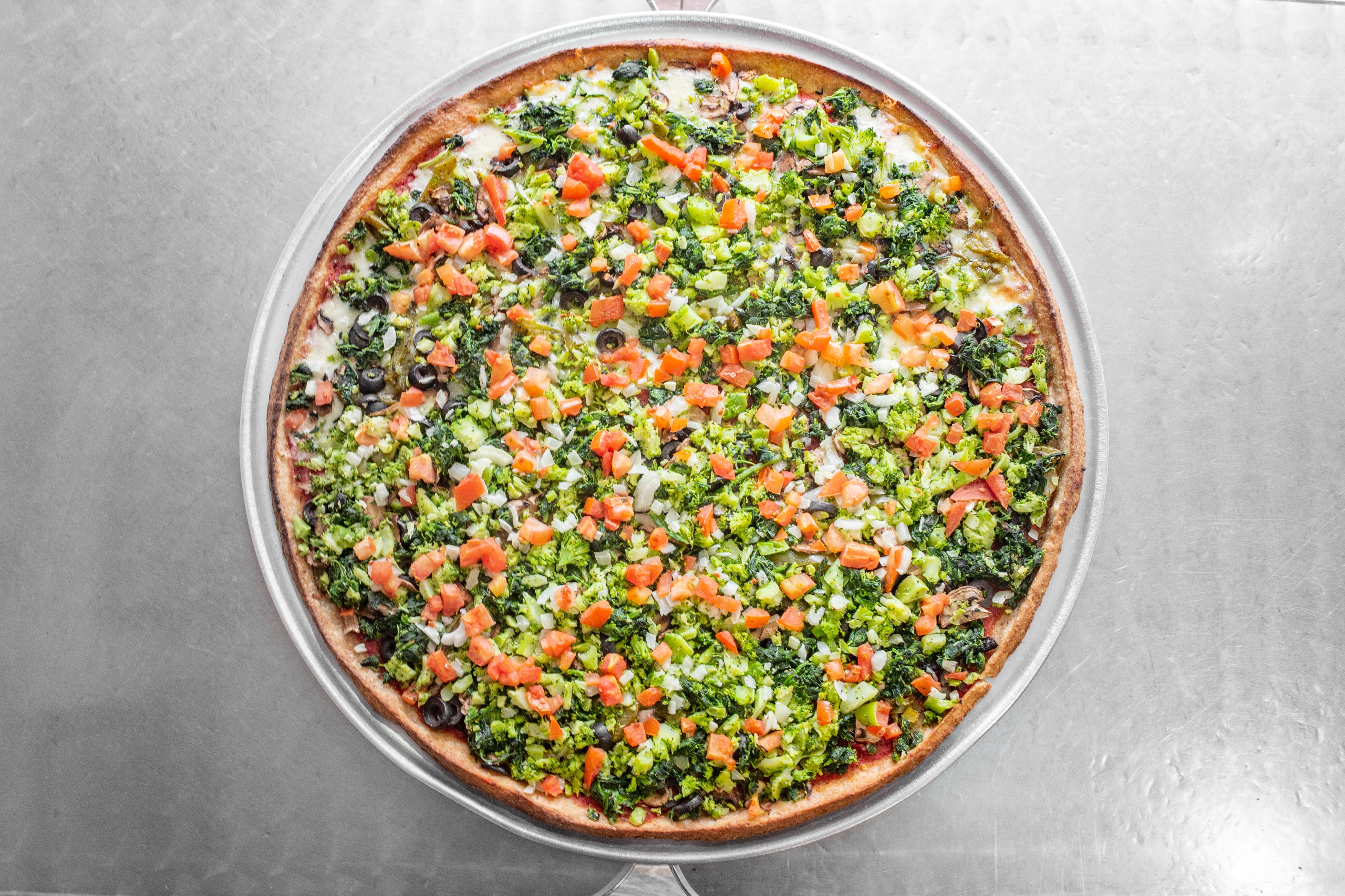 Order Whole Wheat Vegetable Pizza - Medium food online from Not Ray Pizza store, Brooklyn on bringmethat.com