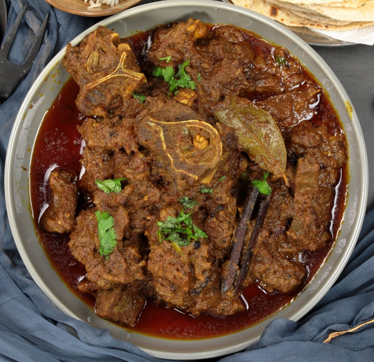 Order Punjabi Goat Curry food online from India Oven store, Roseville on bringmethat.com