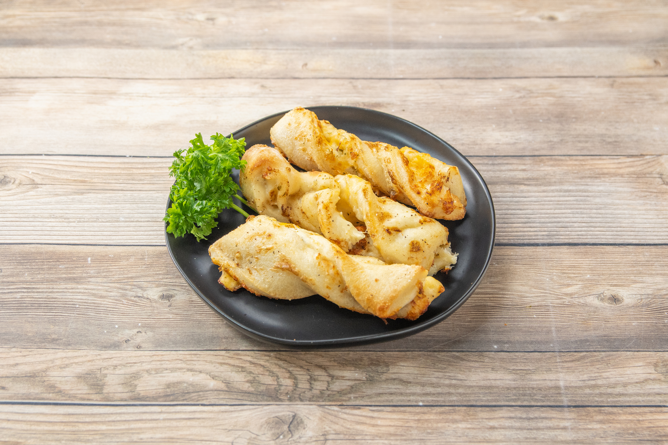 Order Garlic Parmesan Twists™ food online from Round Table Pizza store, Pinole on bringmethat.com