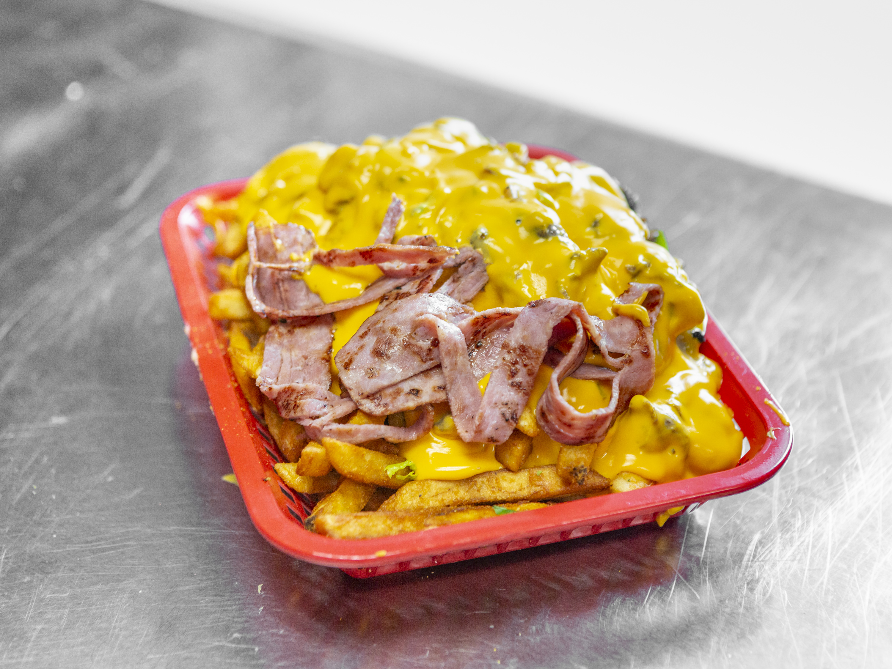 Order Bacon Cheese Fries food online from Moe'z Famous Cheesesteaks store, Ann Arbor on bringmethat.com