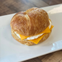 Order Fresh Baked Croissant Sandwich with Egg and Cheese  food online from Simply Vanilla Gourmet store, Lynchburg on bringmethat.com