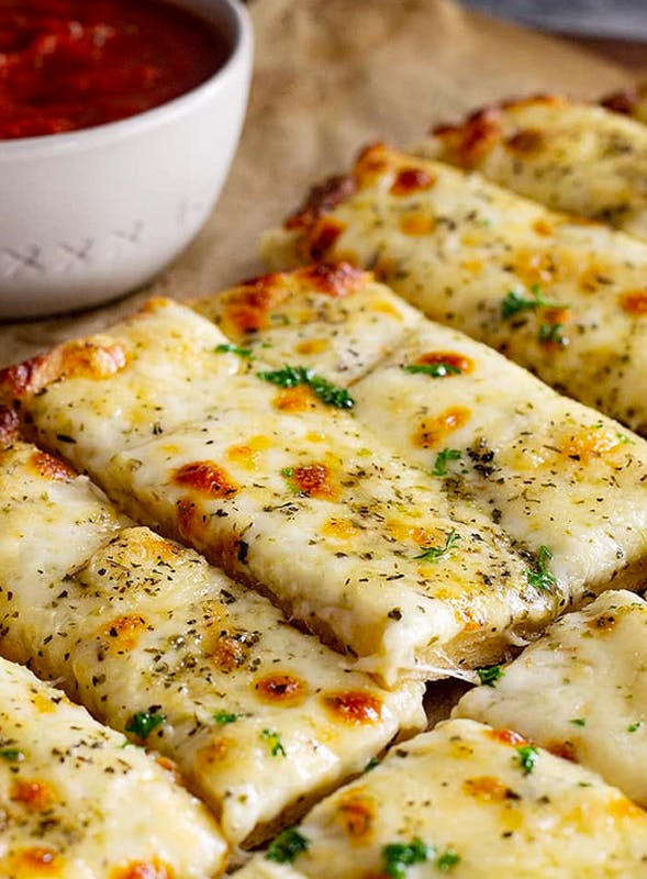 Order Cheesy Garlic Bread Sticks - Appetizer food online from Brother Bruno Pizza store, Washingtonville on bringmethat.com