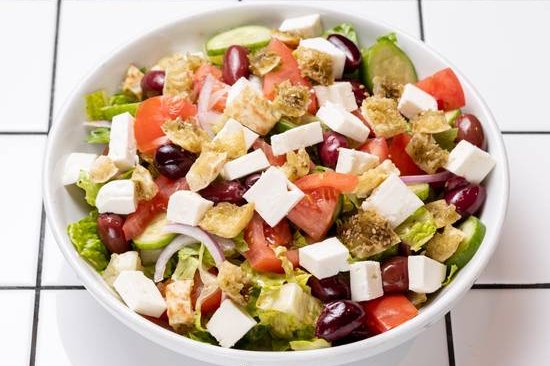 Order Greek Salad food online from 12 chairs store, New York on bringmethat.com
