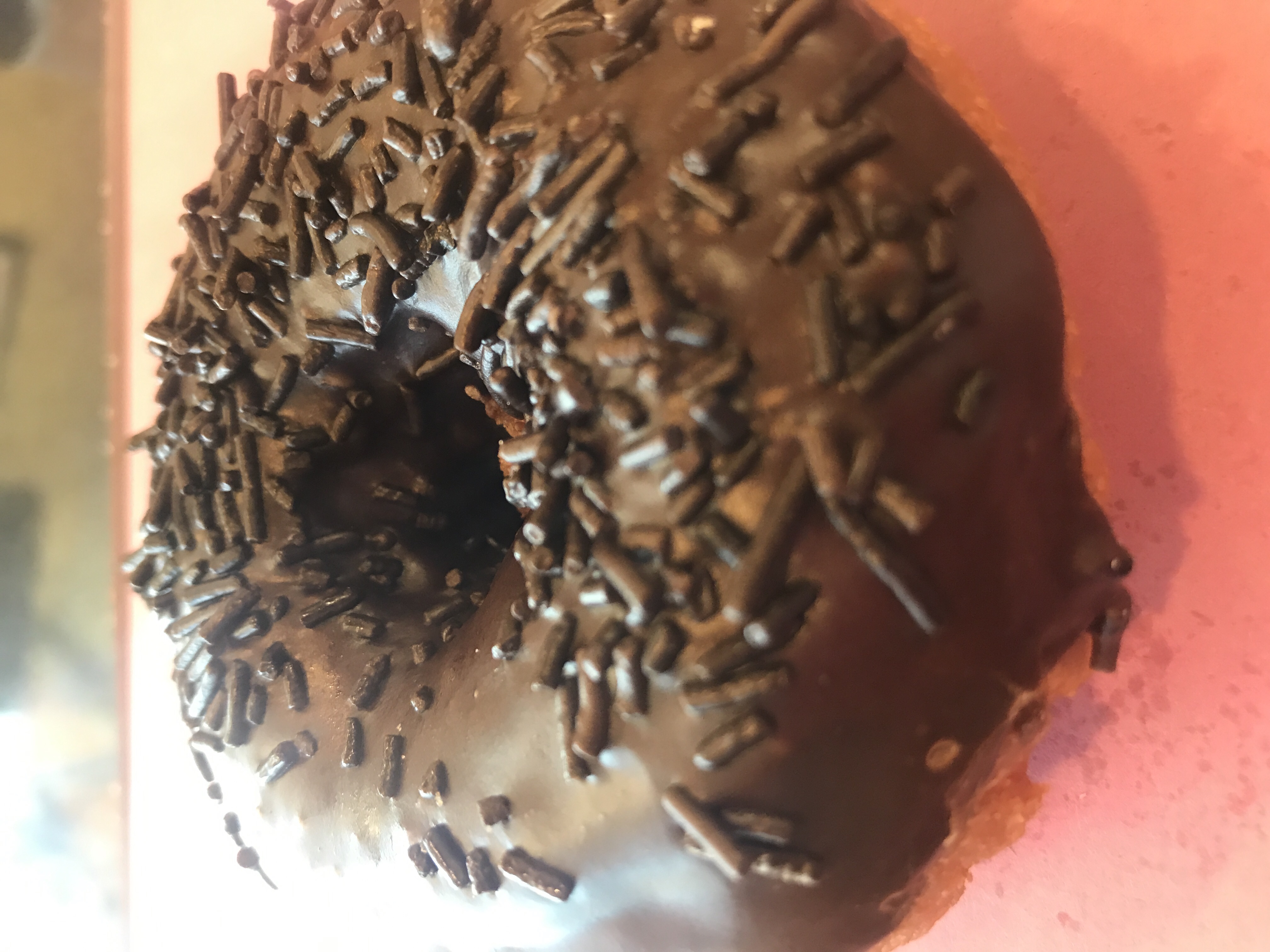 Order White Cake Donut with Chocolate Icing and Chocolate Sprinkle food online from Angel Panama Lane Donuts store, Bakersfield on bringmethat.com