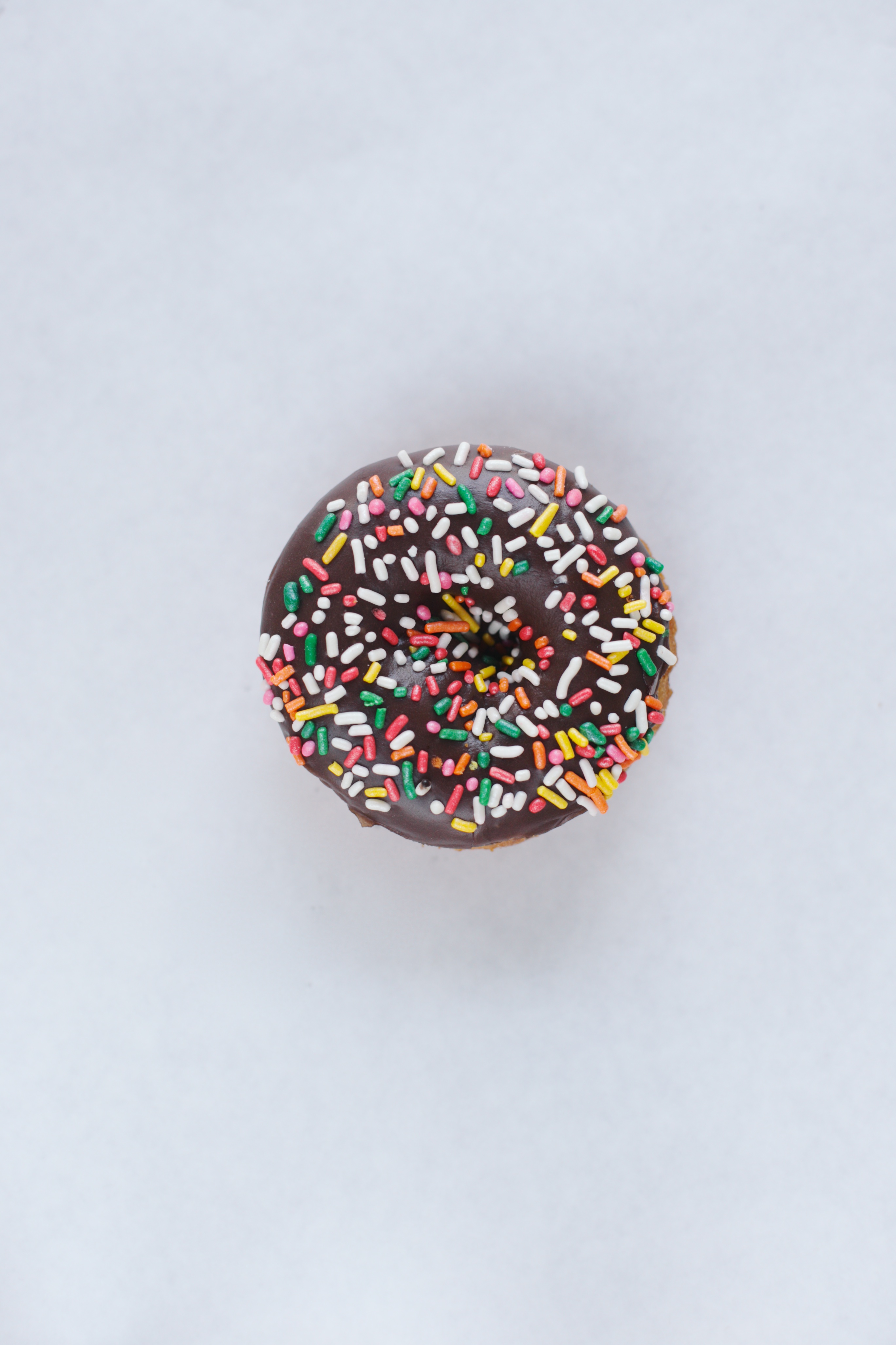 Order Chocolate Rainbow Sprinkle food online from Donut Boss store, Los Alamitos on bringmethat.com