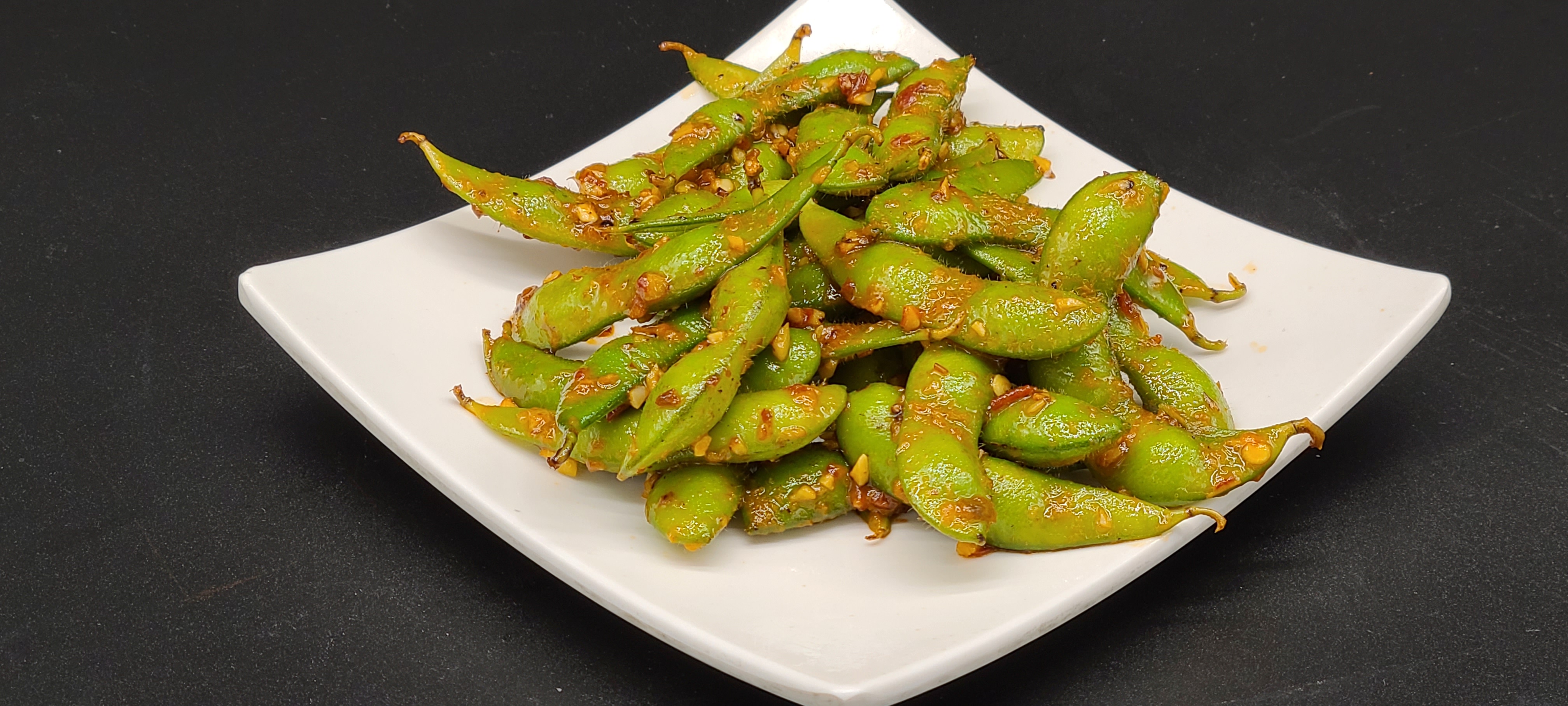 Order A12. Spicy Garlic Edamame food online from Hello Sushi store, Fullerton on bringmethat.com