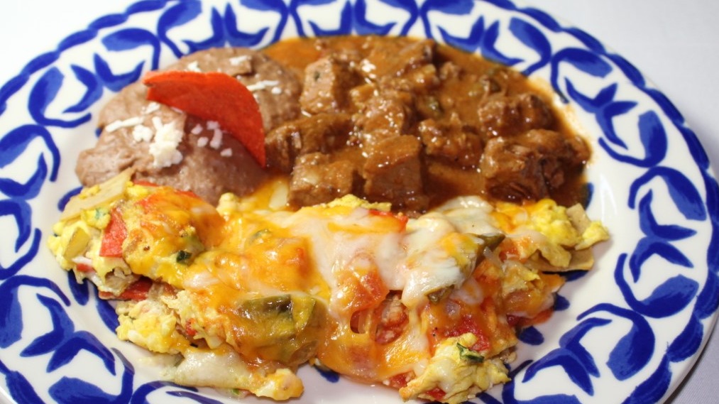 Order Chilaquiles Famosos food online from Mi Tierra Cafe & Bakery store, San Antonio on bringmethat.com