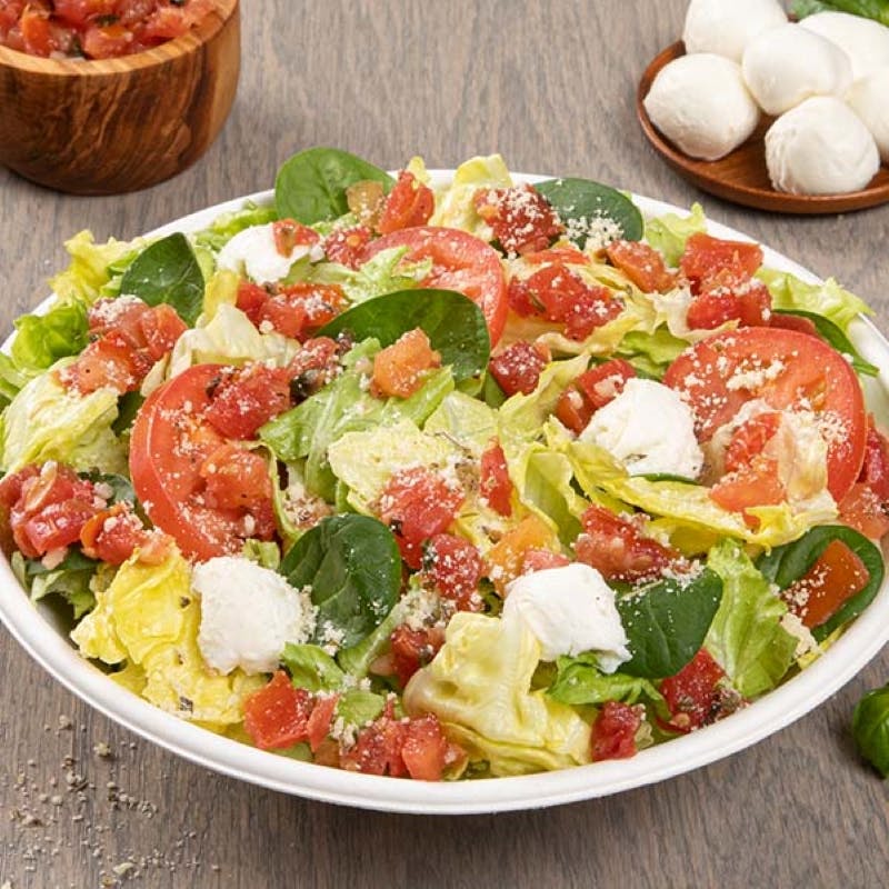 Order Caprese Side Salad - Salad food online from Donatos Pizza store, Hudson on bringmethat.com