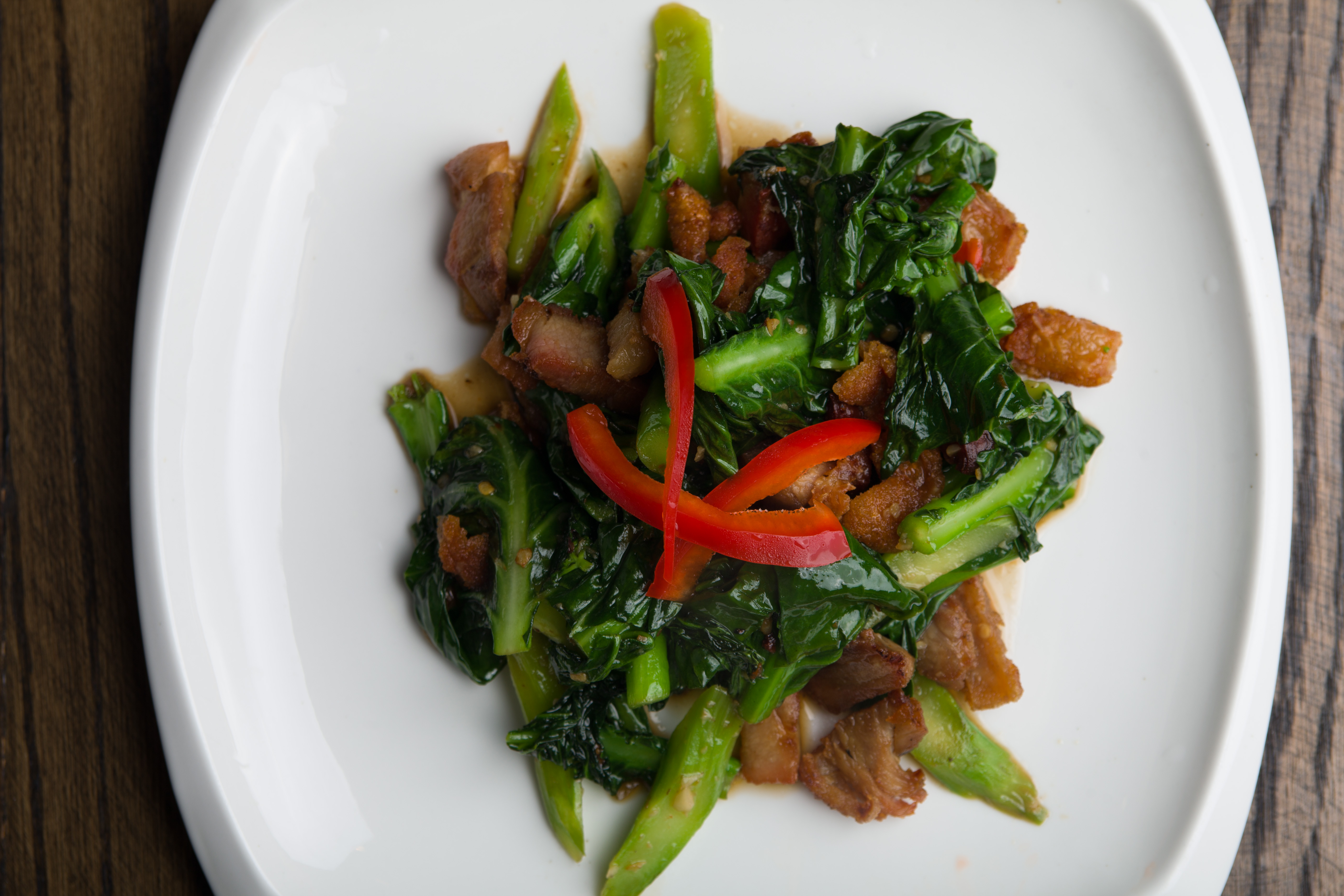 Order H2. Crispy Pork with Chinese Broccoli food online from Tasty Thai store, Ridgewood on bringmethat.com