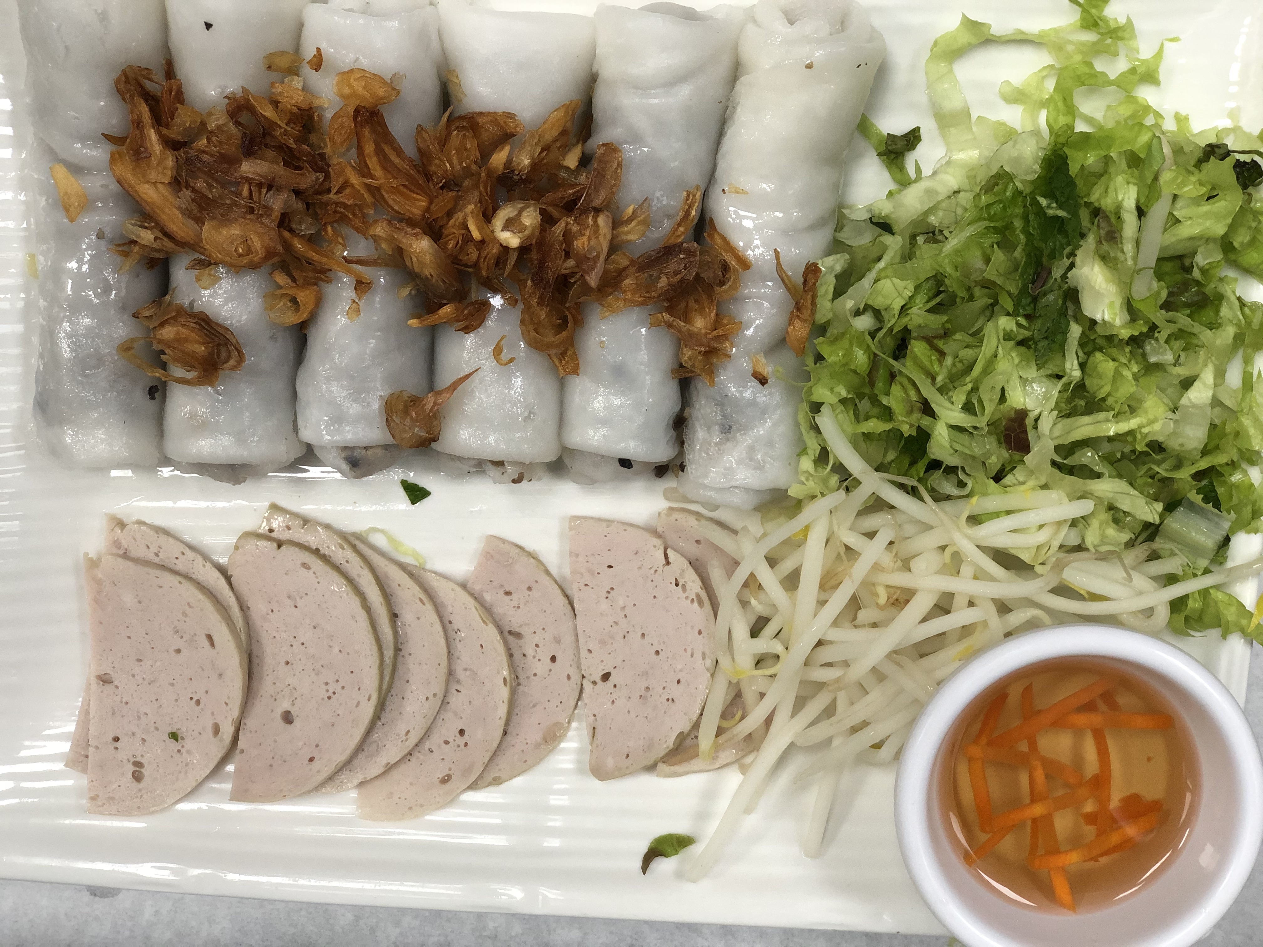 Order 60. Steamed Rice Rolls Wrapped with Ground Pork Specialty food online from Oasis Vietnamese Cuisine store, Pacifica on bringmethat.com