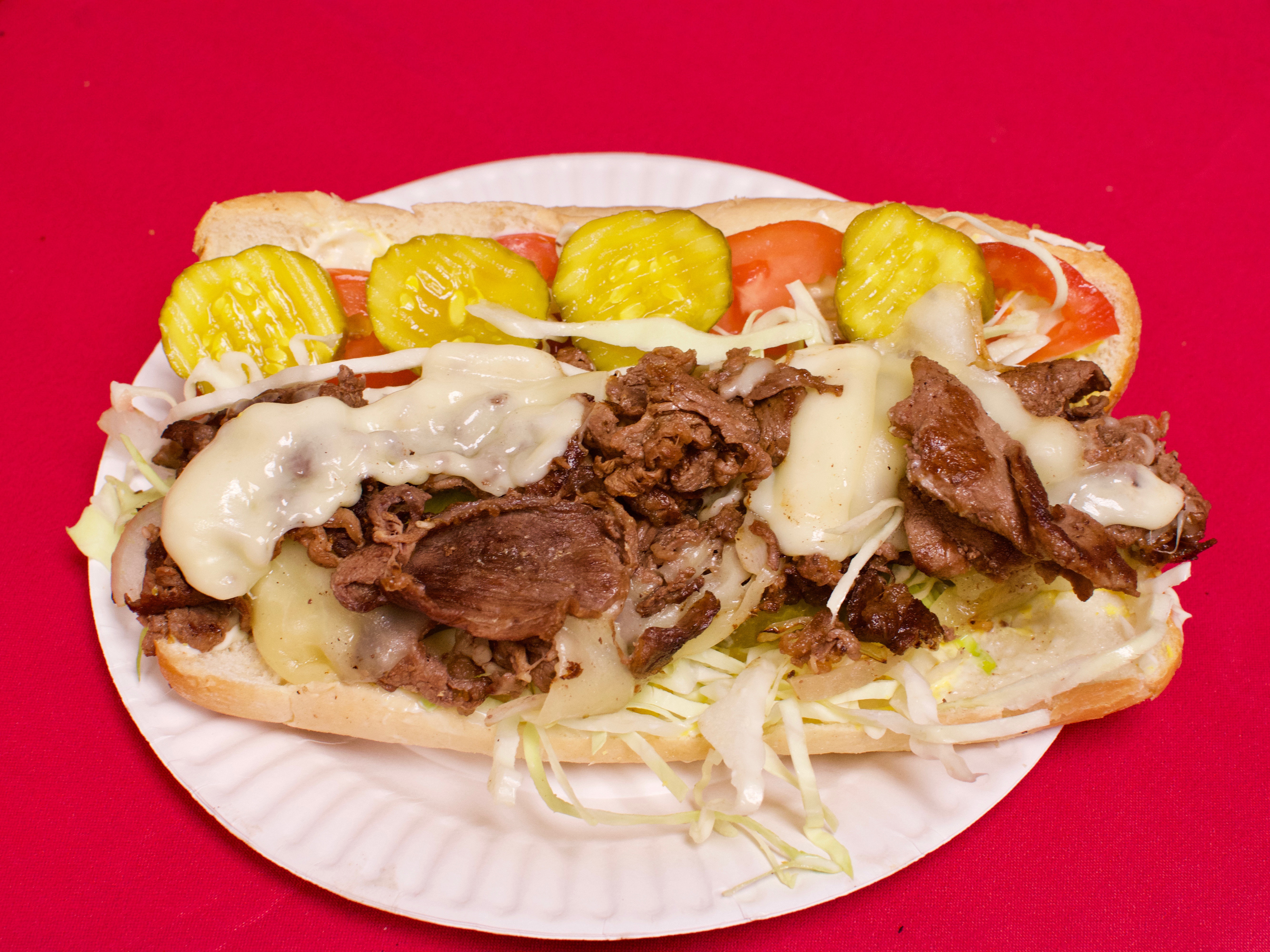 Order Famous Rib Eye Steak and Cheese Sub food online from Mario's Pizza House store, Arlington on bringmethat.com
