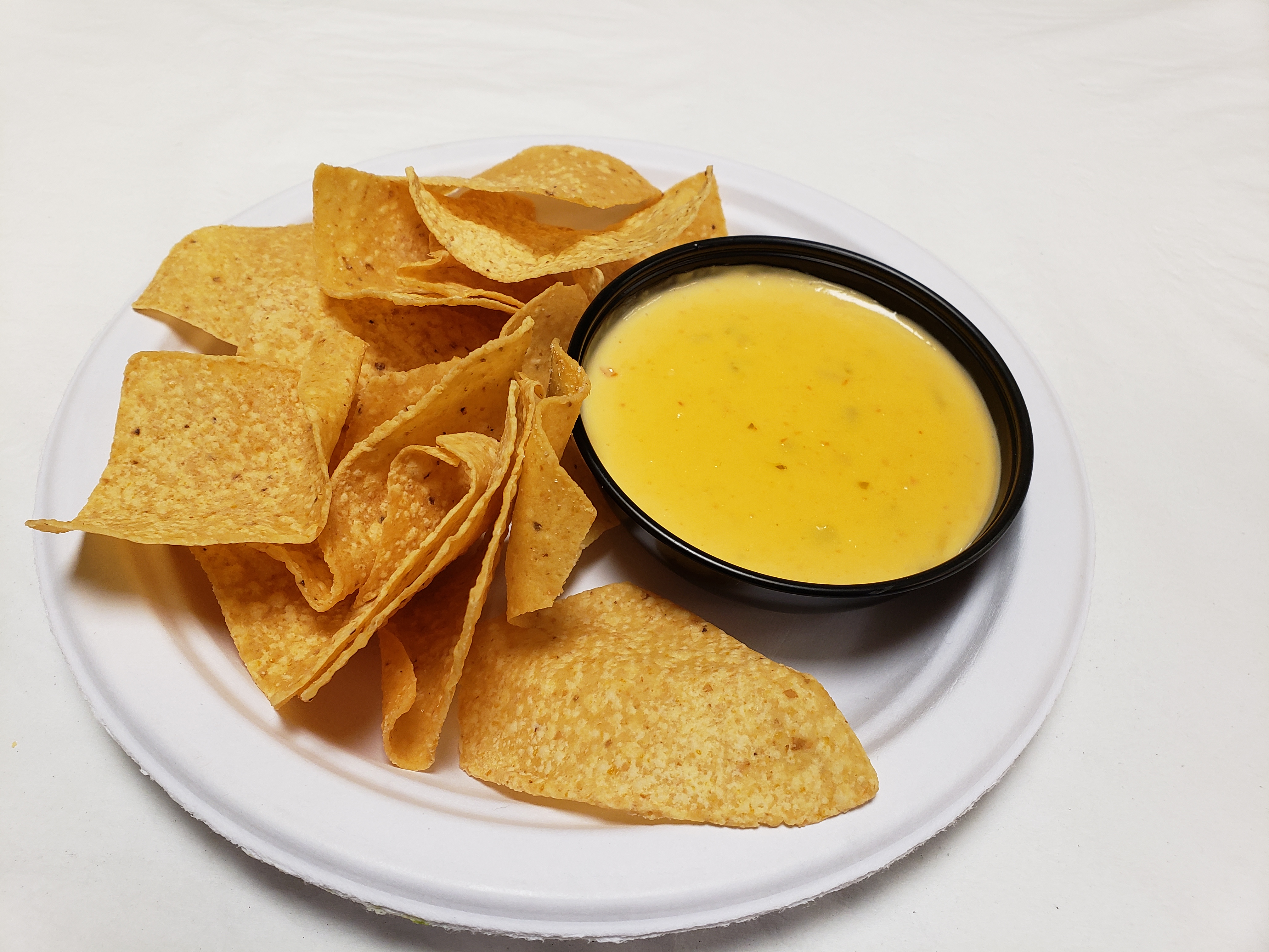 Order Chips and 8 oz. Queso food online from Poblanos Mexican Cafe store, Dallas on bringmethat.com