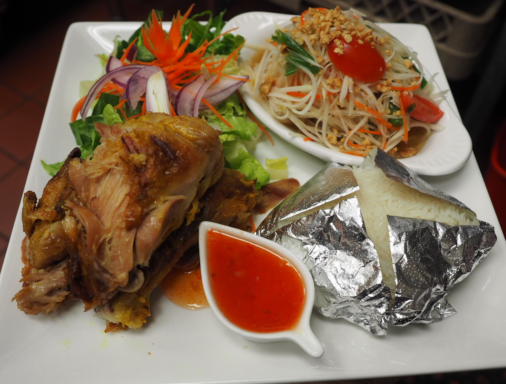 Order B.B.Q Chicken with Green Papaya Salad and Sticky Rice food online from Smile Thai store, Harbor City on bringmethat.com