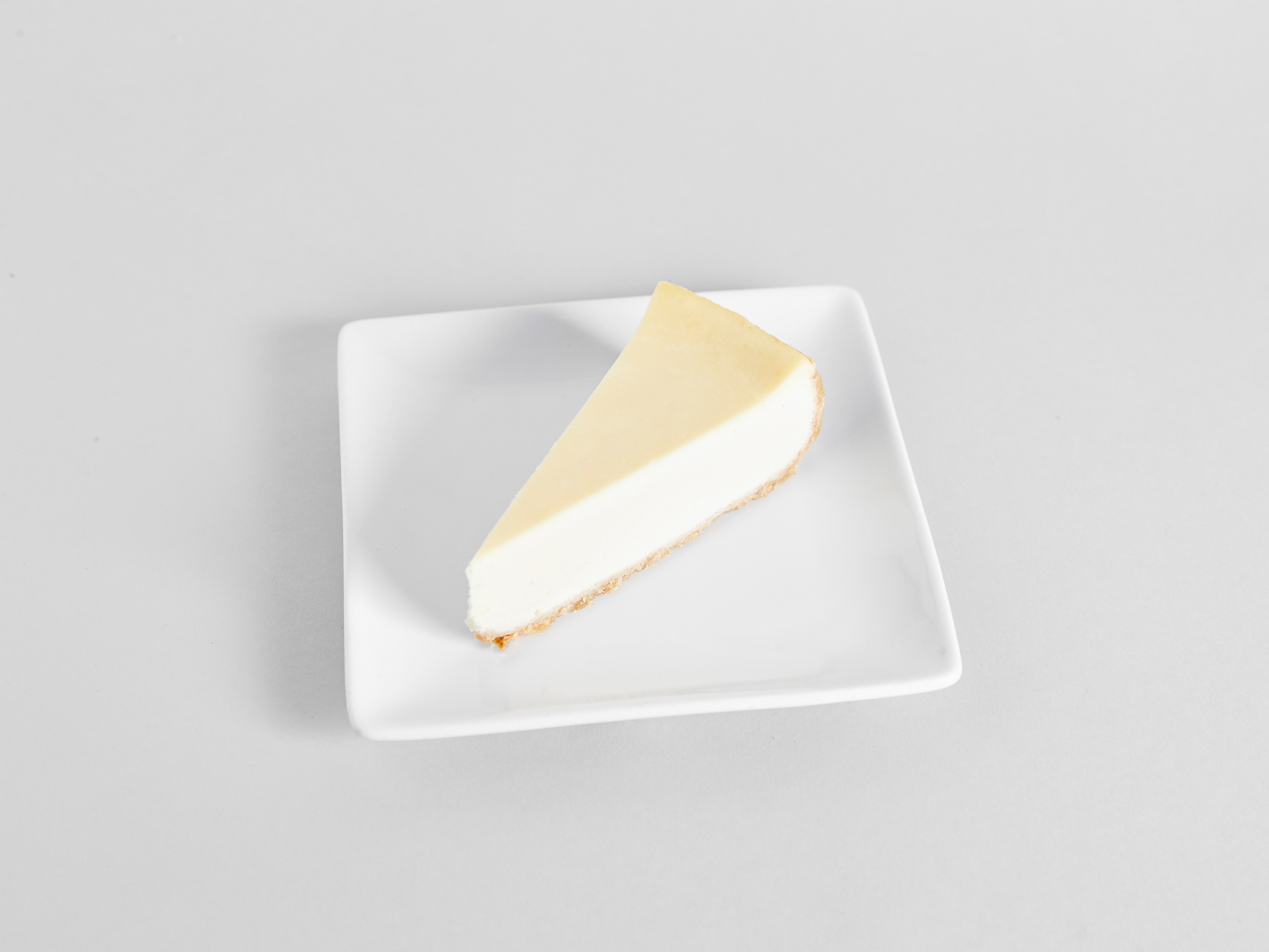 Order Classic Cheesecake (slice) food online from Sweetwaters Coffee & Tea store, Toms River on bringmethat.com