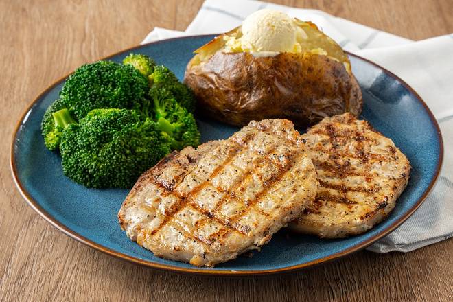 Order Mesquite-Grilled Pork Chops food online from Logan's Roadhouse store, Florence on bringmethat.com