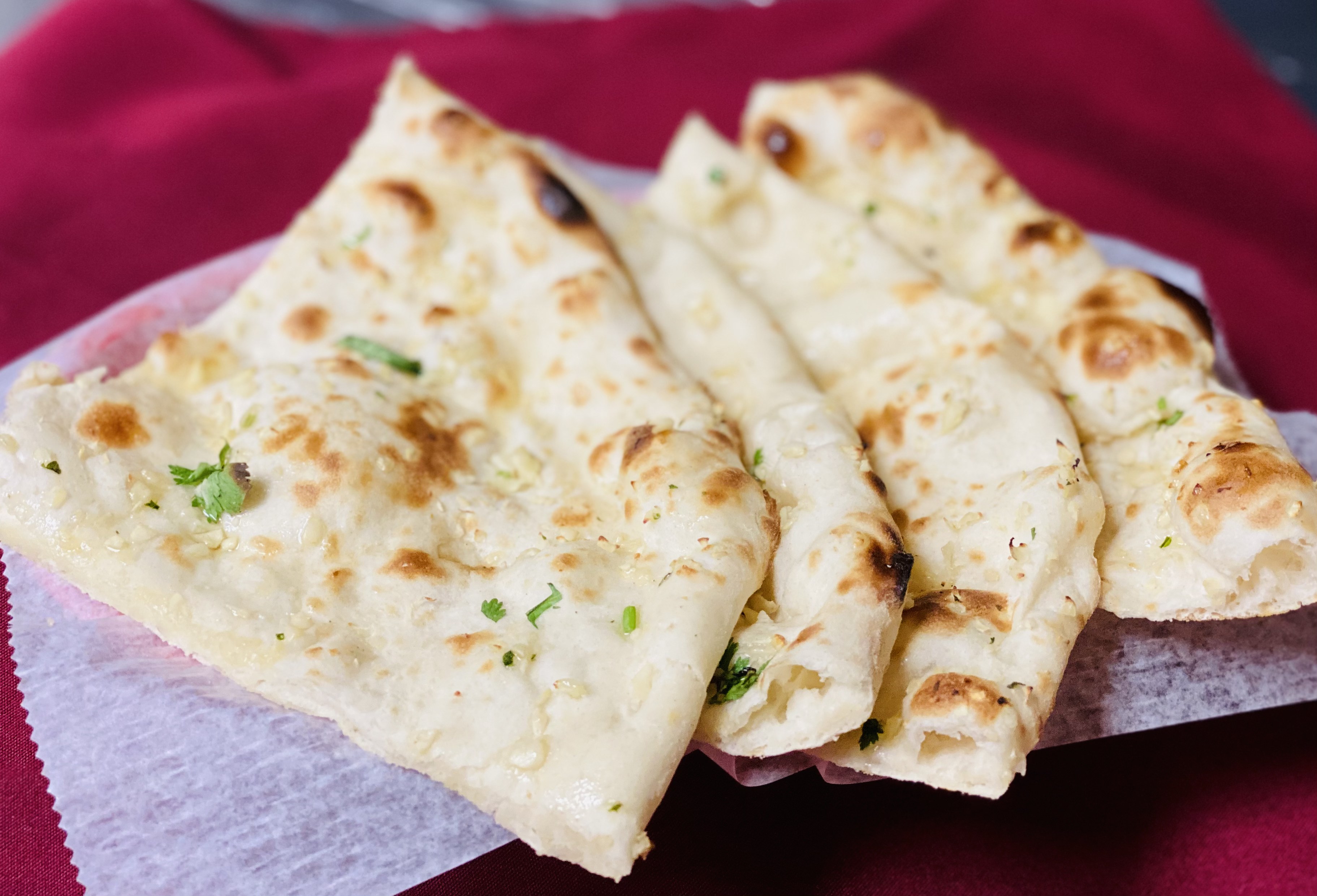 Order Garlic Naan food online from Roti House store, Jersey City on bringmethat.com