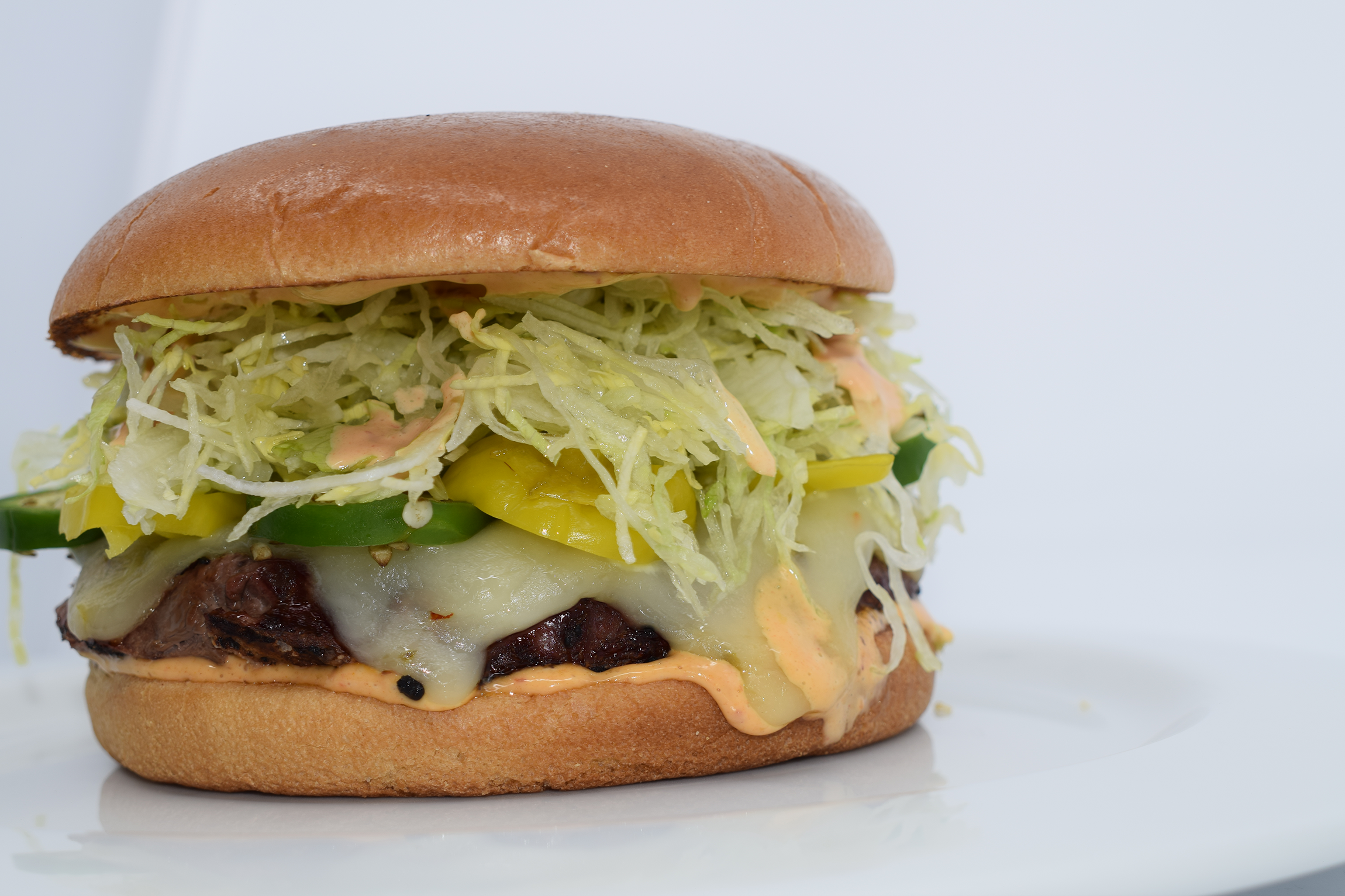 Order THE AZTEC BURGER food online from Mad House Comedy Club store, San Diego on bringmethat.com