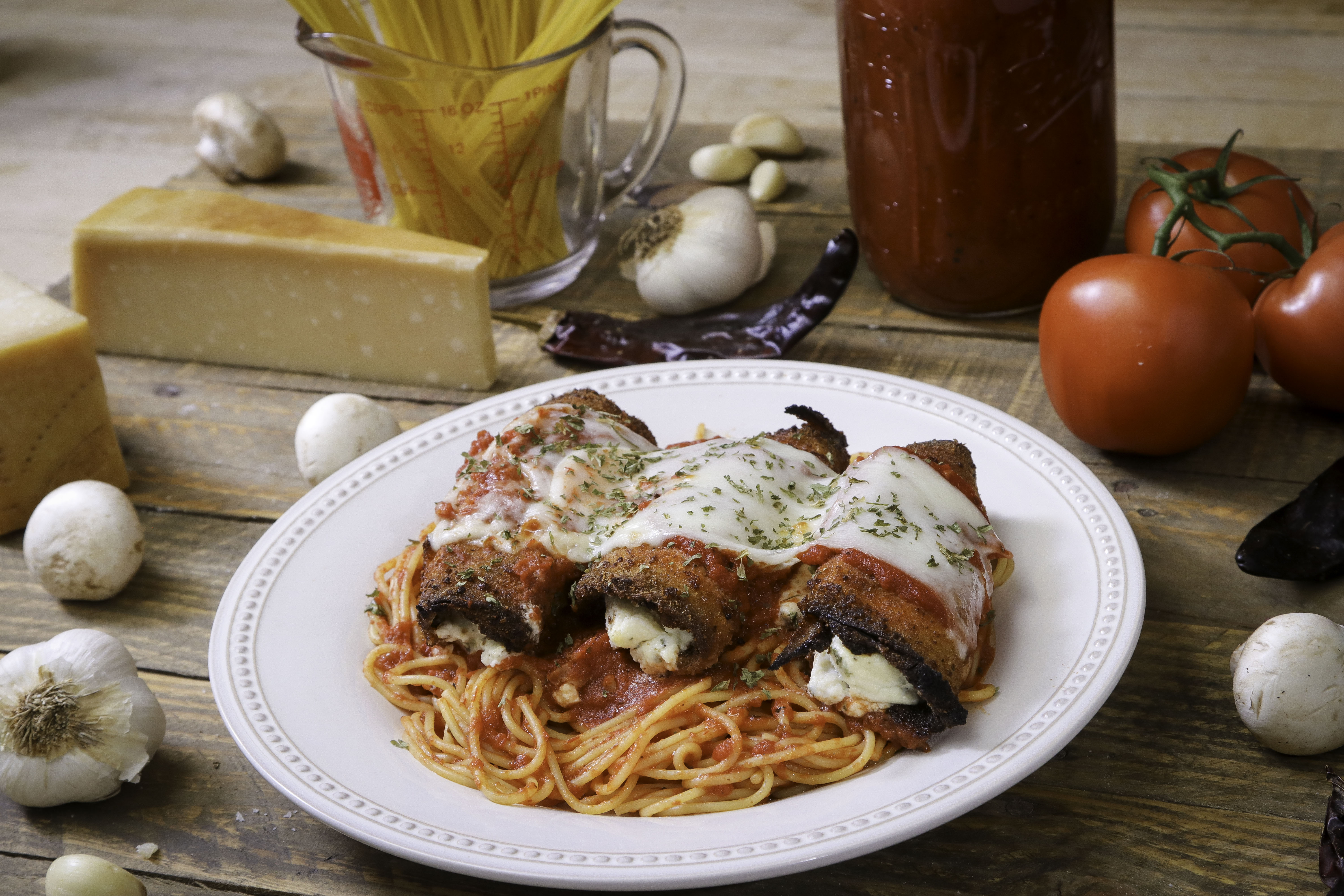 Order Eggplant Parmigiana with Spaghetti food online from Ameci Pizza & Pasta store, Lake Forest on bringmethat.com