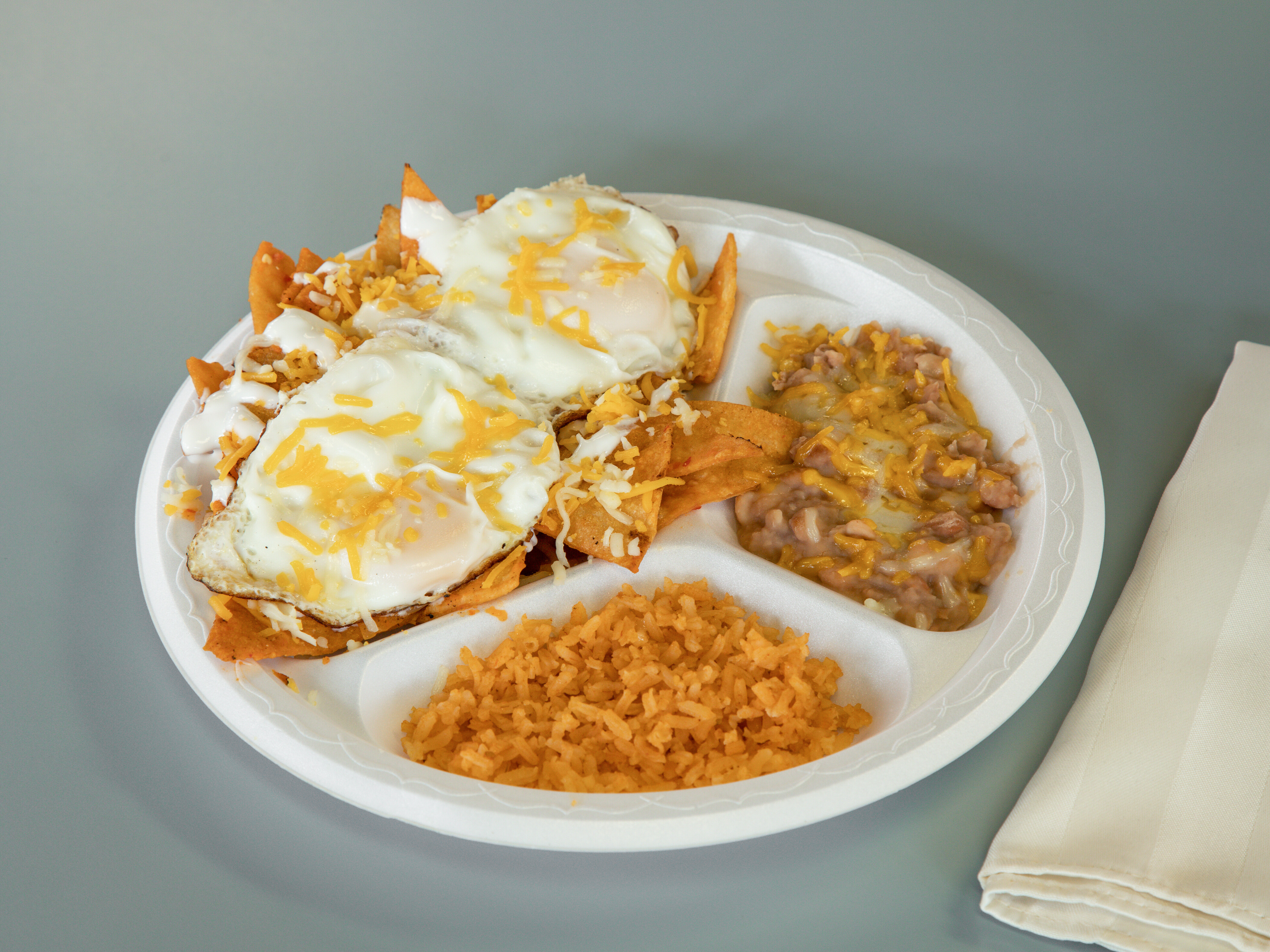 Order Chilaquiles Plate (includes small drink) food online from Aldertos Fresh Mexican Food store, Reno on bringmethat.com