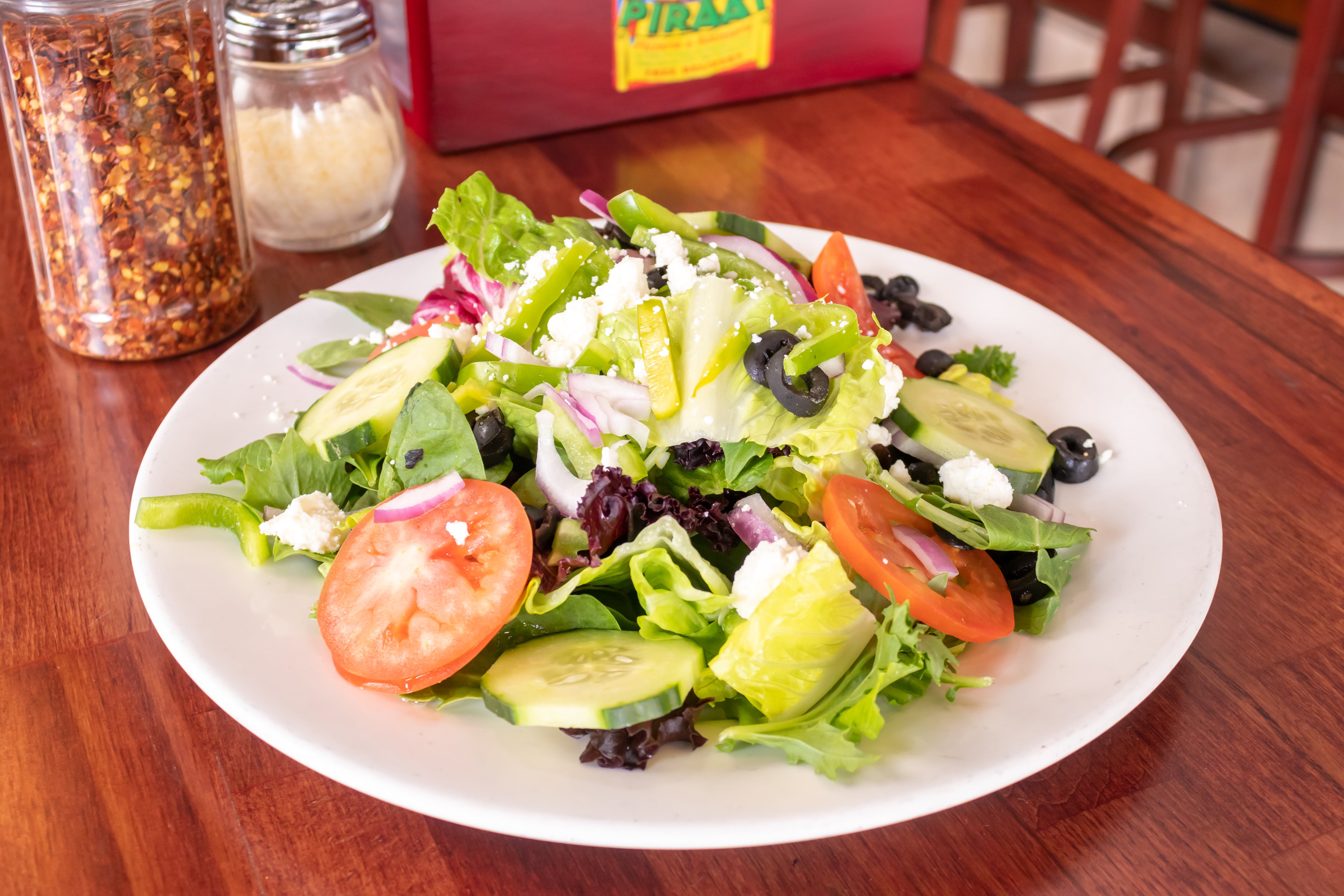 Order Greek Salad - Salad food online from Piraat Pizzeria store, San Francisco on bringmethat.com