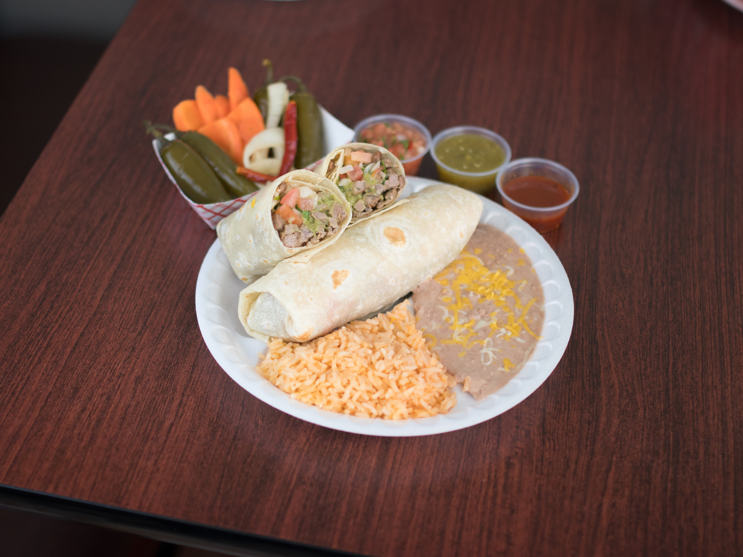 Order Chicken Burrito food online from Linas Mexican Restaurant store, Omaha on bringmethat.com
