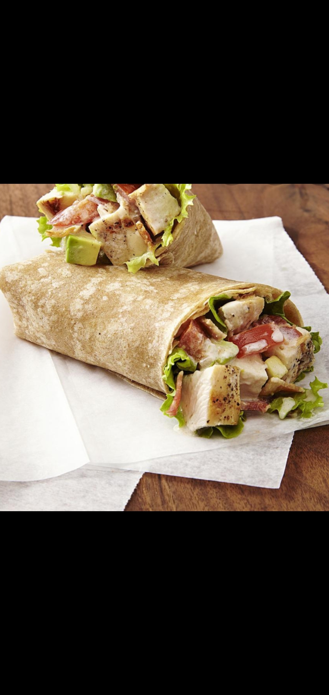 Order Chicken Club Wrap (chicken cutlet bacon cheese lettuce tomatoes wrap) food online from American Gourmet Foods Deli store, New York on bringmethat.com