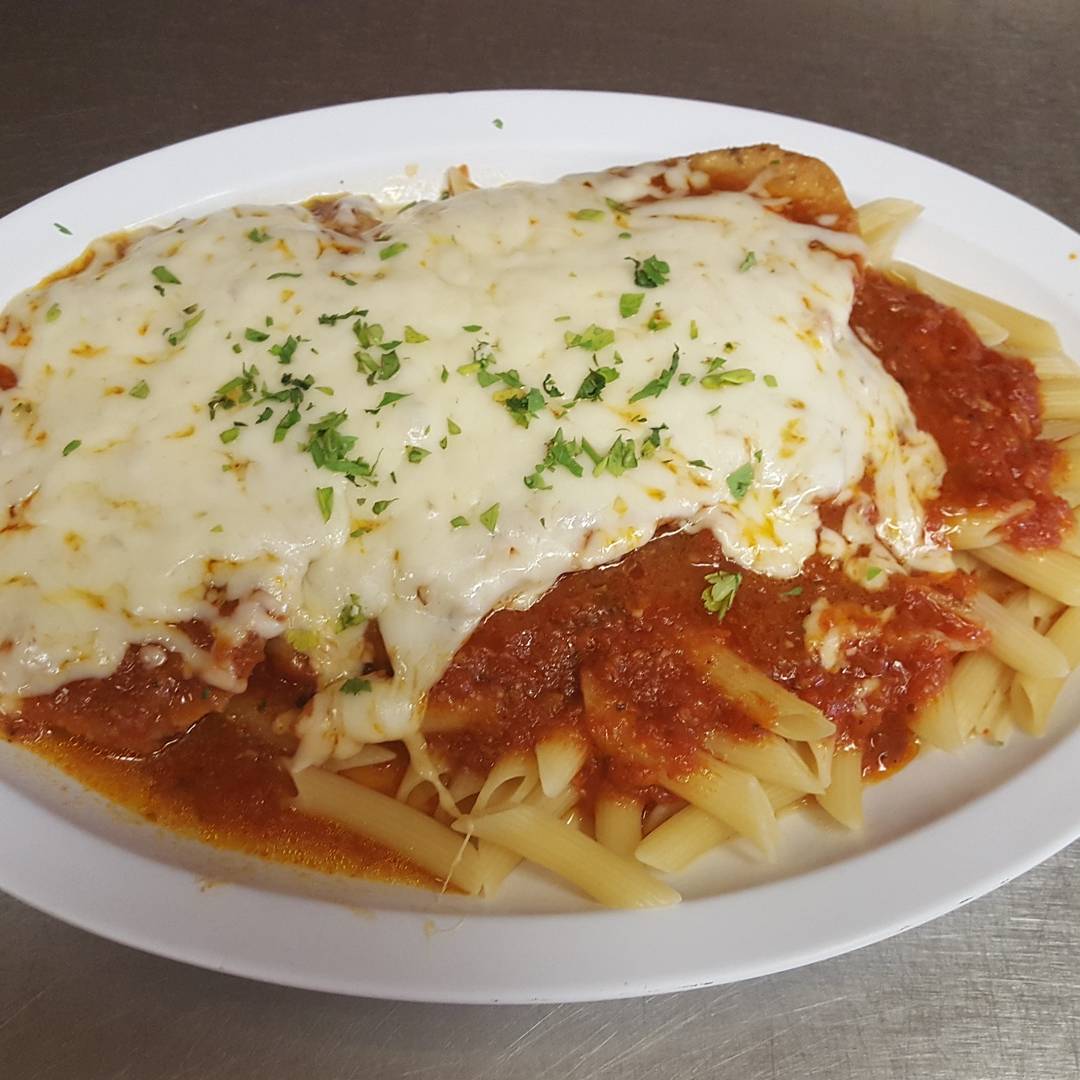 Order Chicken Parmigiana Dinner food online from Pizzarelli's Pizza store, Scarsdale on bringmethat.com
