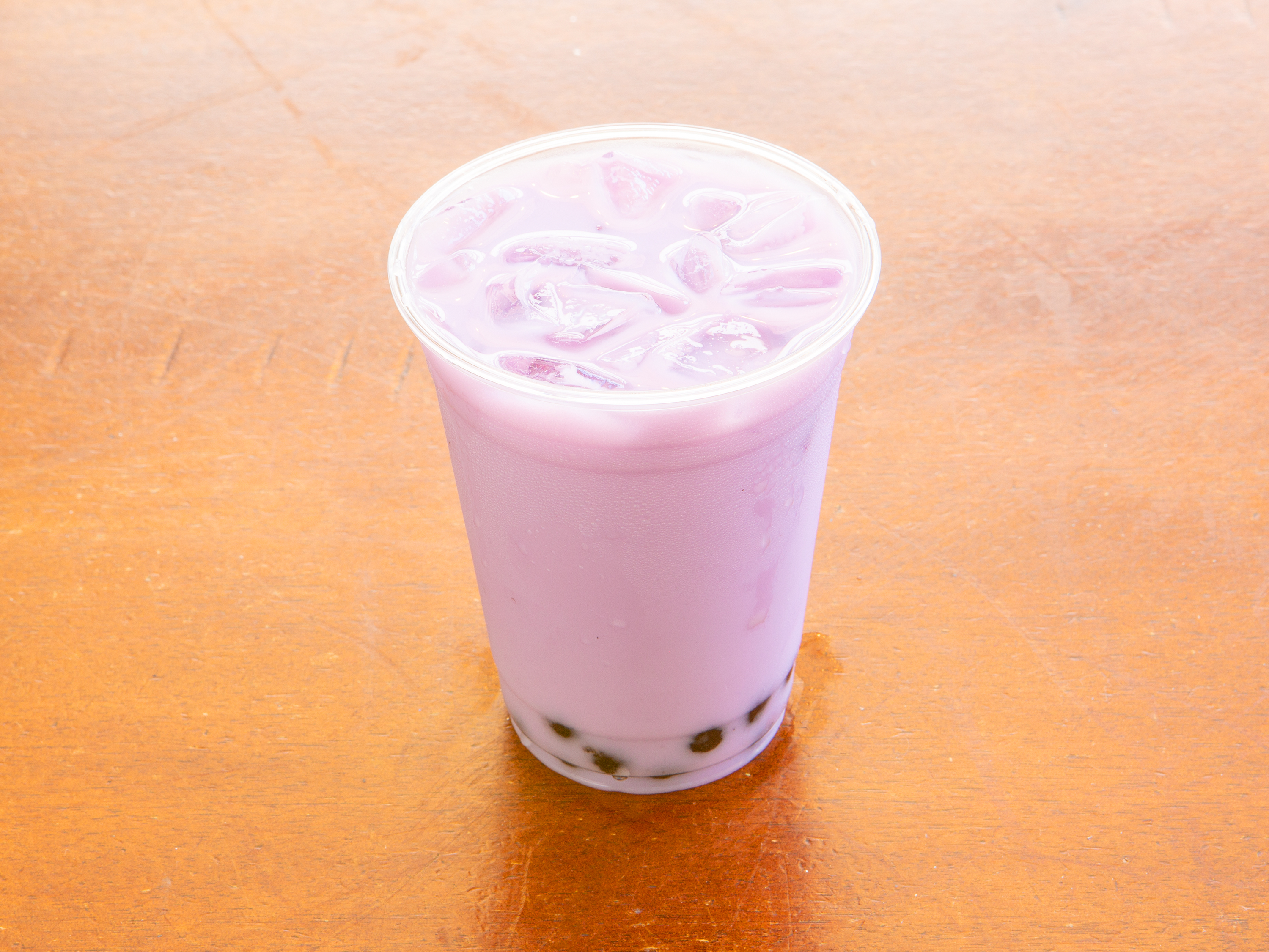Order 6. Taro Milk Tea food online from Laughing Tiger Tea House store, Santa Barbara on bringmethat.com