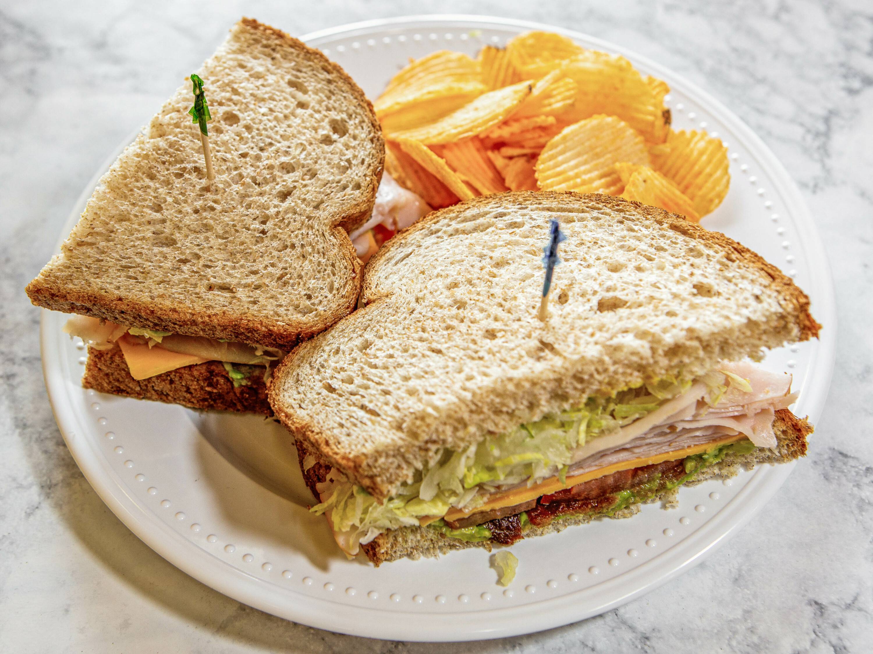 Order Turkey Deluxe Sandwich food online from Sabrina Cafe & Deli store, San Diego on bringmethat.com