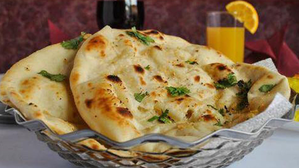 Order Tandoori Butter Naan food online from Biryani Pointe store, Lombard on bringmethat.com