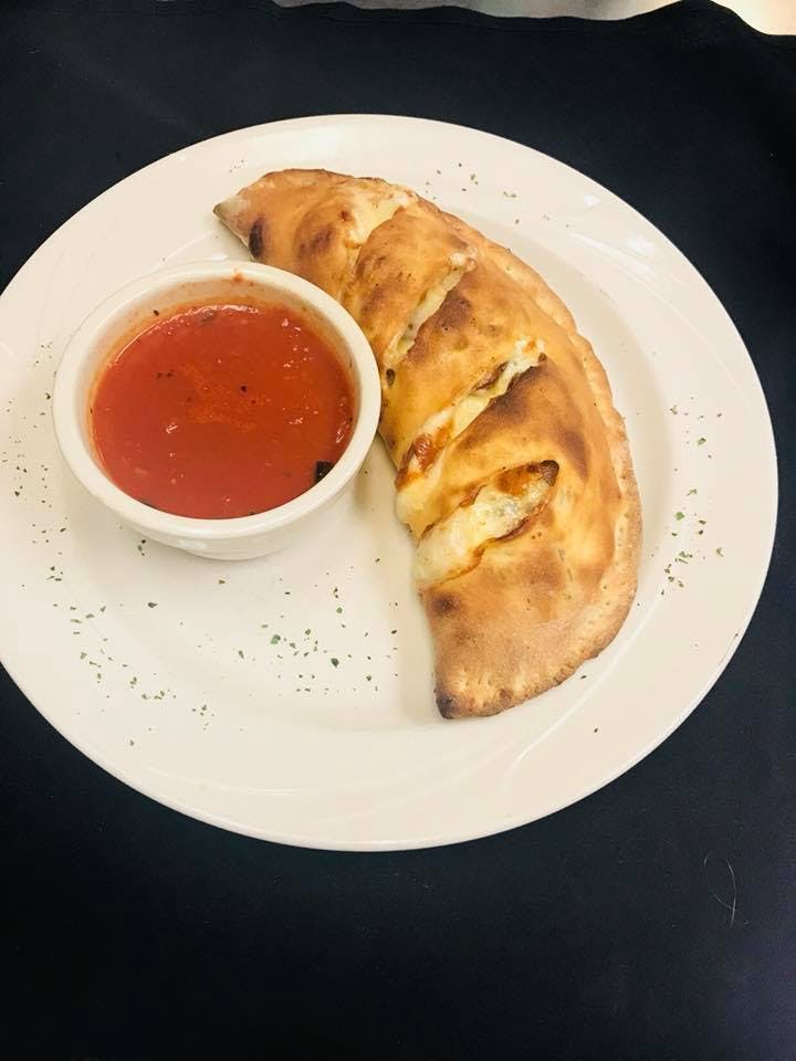 Order Calzone - Calzone food online from  Bella Italia Restaurant store, Wappingers Falls on bringmethat.com