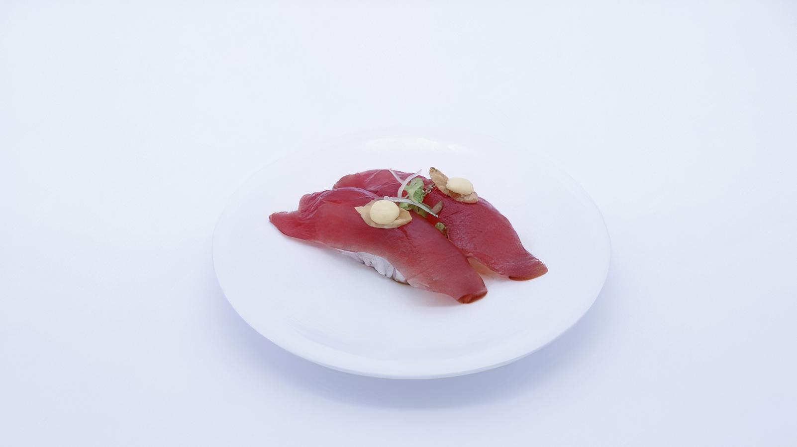 Order Garlic Tuna (2 Pieces) food online from Sapporo Revolving Sushi store, Las Vegas on bringmethat.com