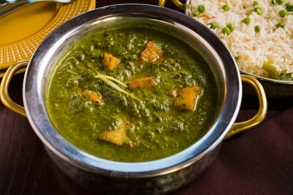 Order Aloo Saag food online from Dhaba indian cuisine store, New York on bringmethat.com