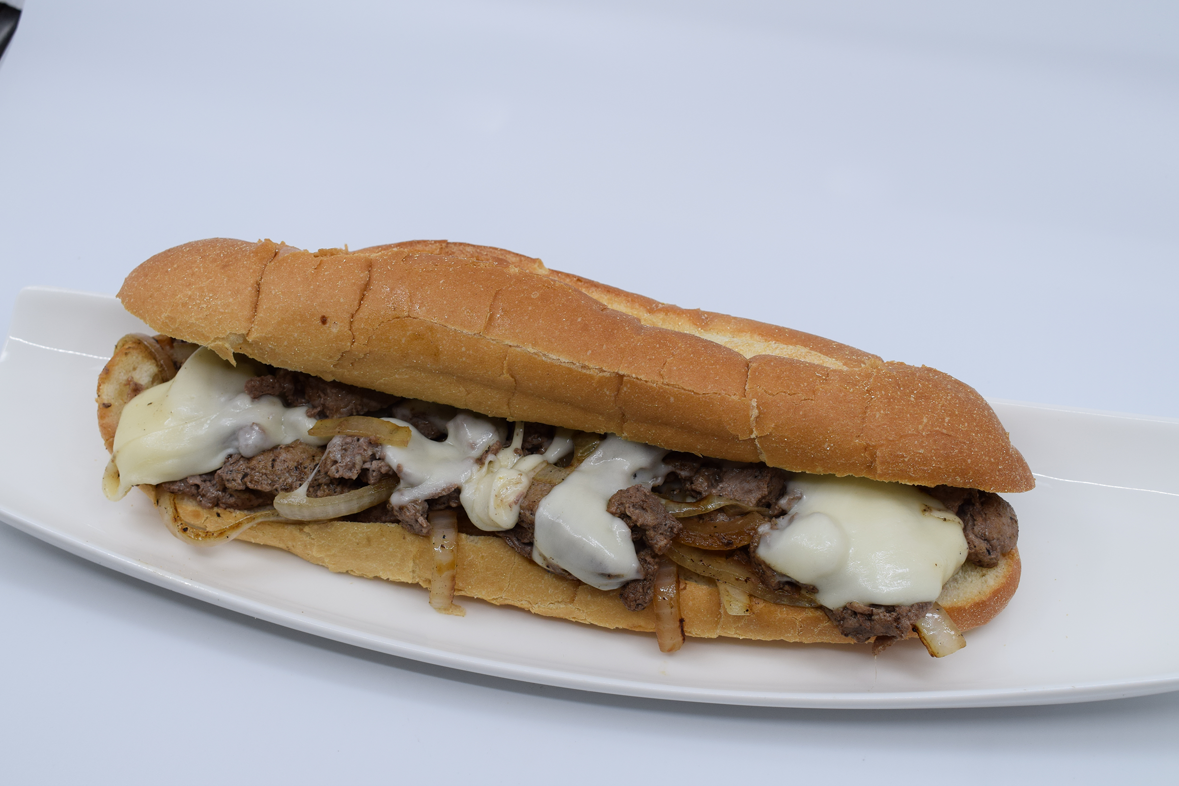 Order THE CLASSIC PHILLY CHEESESTEAK SANDWICH food online from Burger Fanatics store, San Diego on bringmethat.com