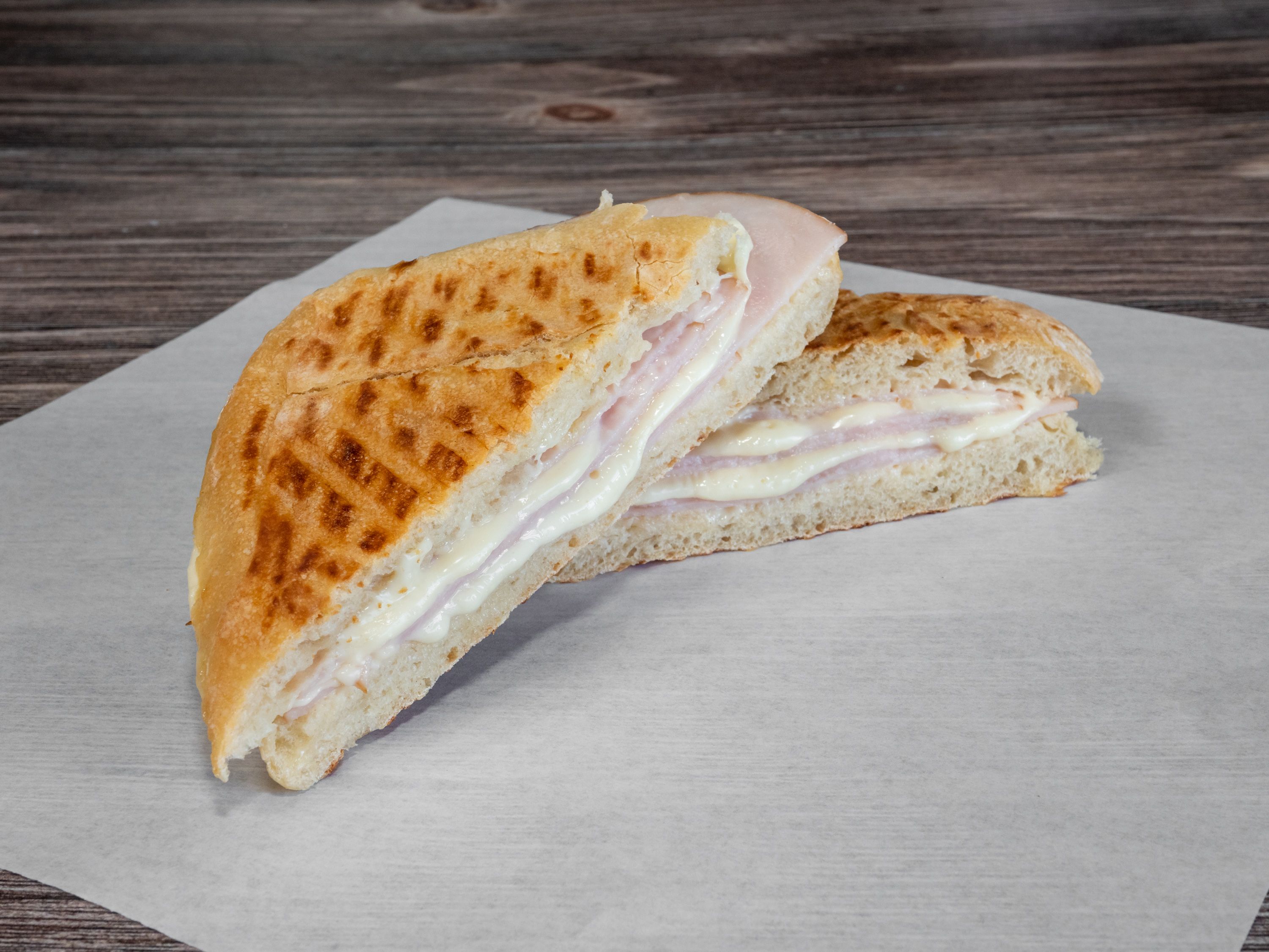 Order Ham and Cheese Panini Sandwich food online from Oddi Cafe store, San Jose on bringmethat.com