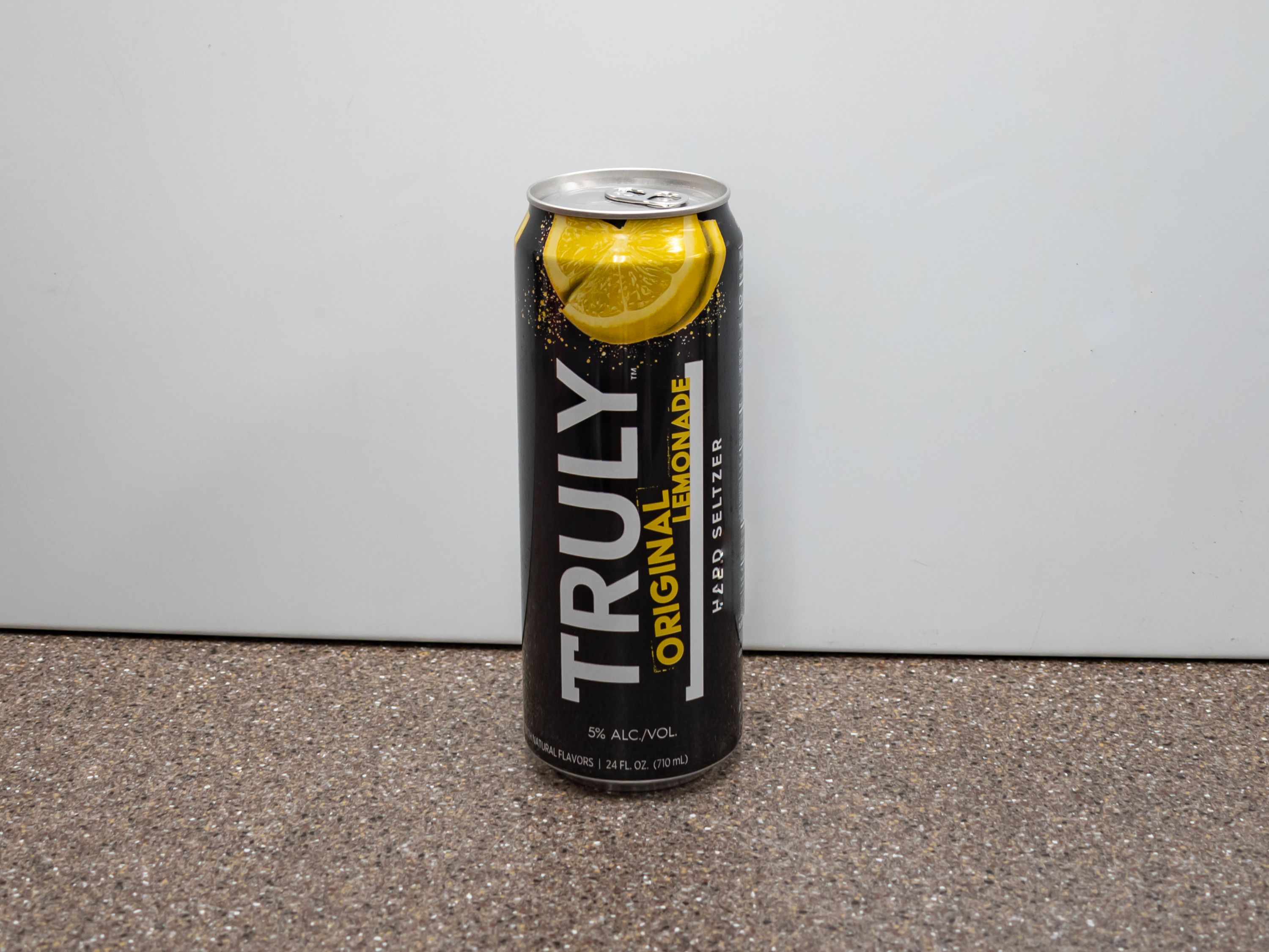 Order Truly Lemonade Hard Seltzer Spiked & Sparkling Water,  24 oz. Can food online from Kangaroo Food Mart store, Cathedral City on bringmethat.com