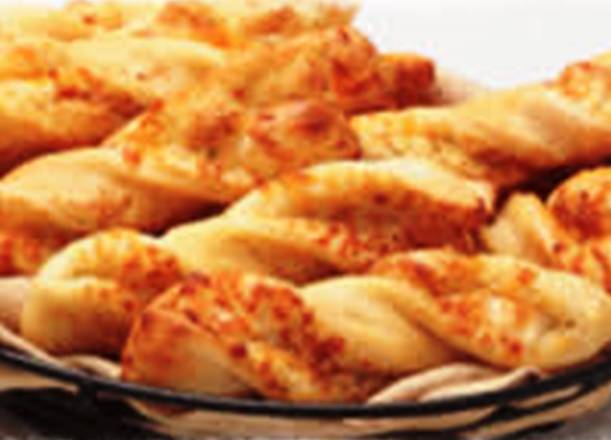 Order Garlic Parmesan Twists™ (6 Twists) food online from Round Table Pizza store, Millbrae on bringmethat.com