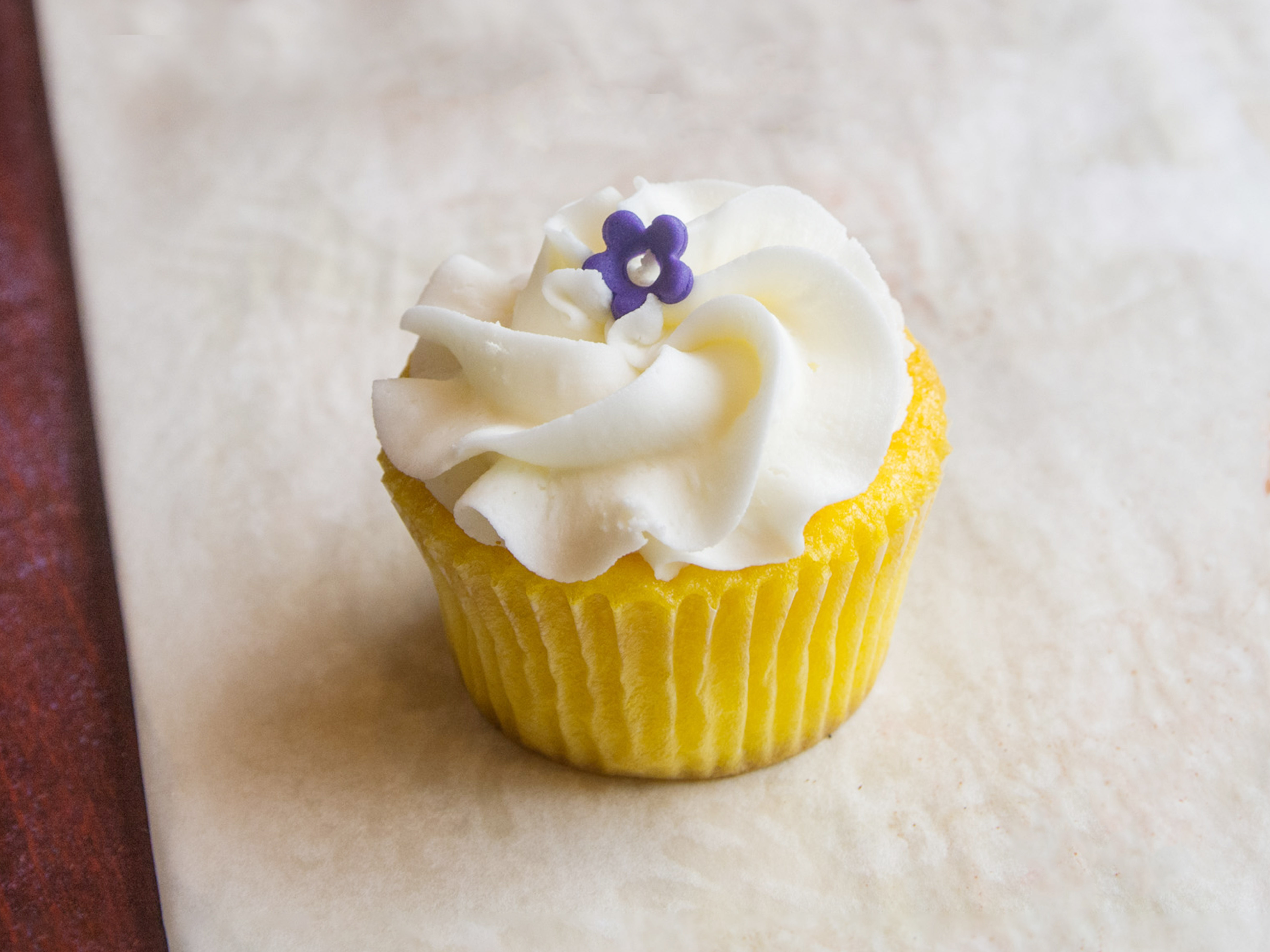 Order Lemon and Lemon Butter Cream Cupcake food online from Oh, What A Cake! store, Columbia on bringmethat.com