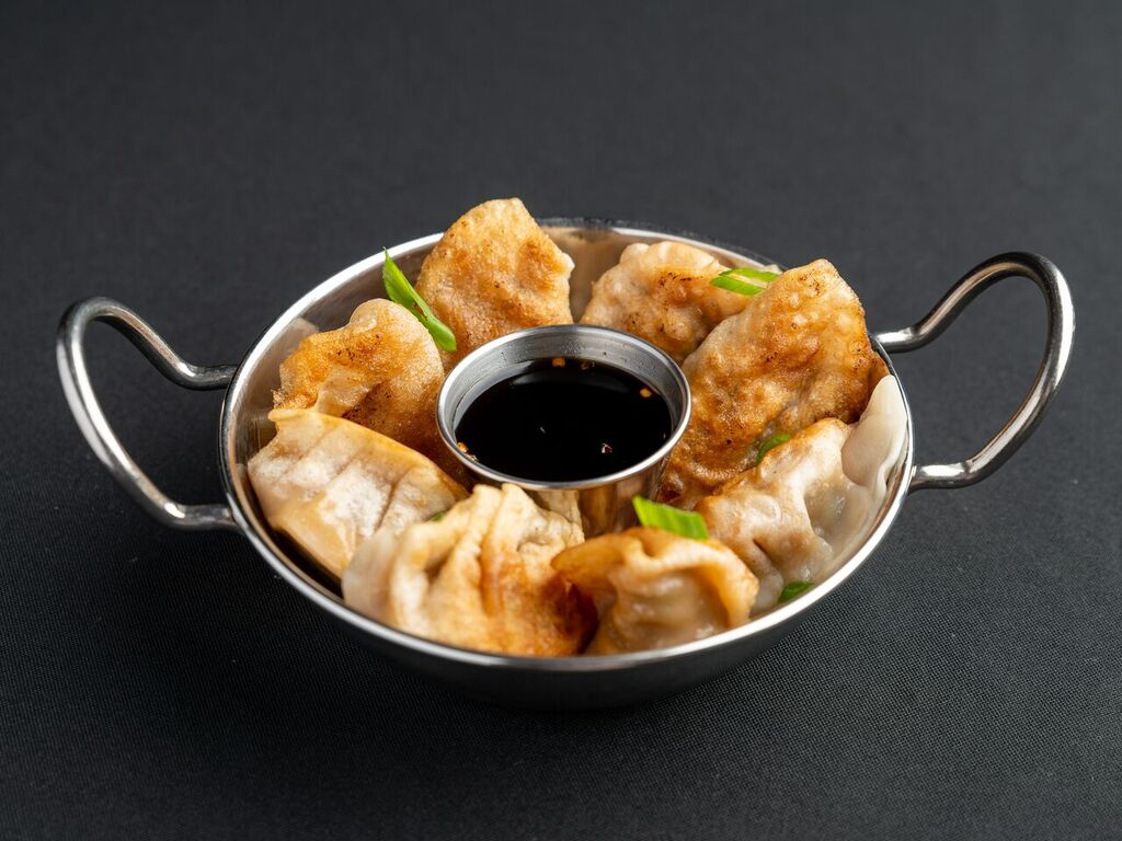 Order 9. Fried Dumplings  food online from China Wok store, Madison on bringmethat.com