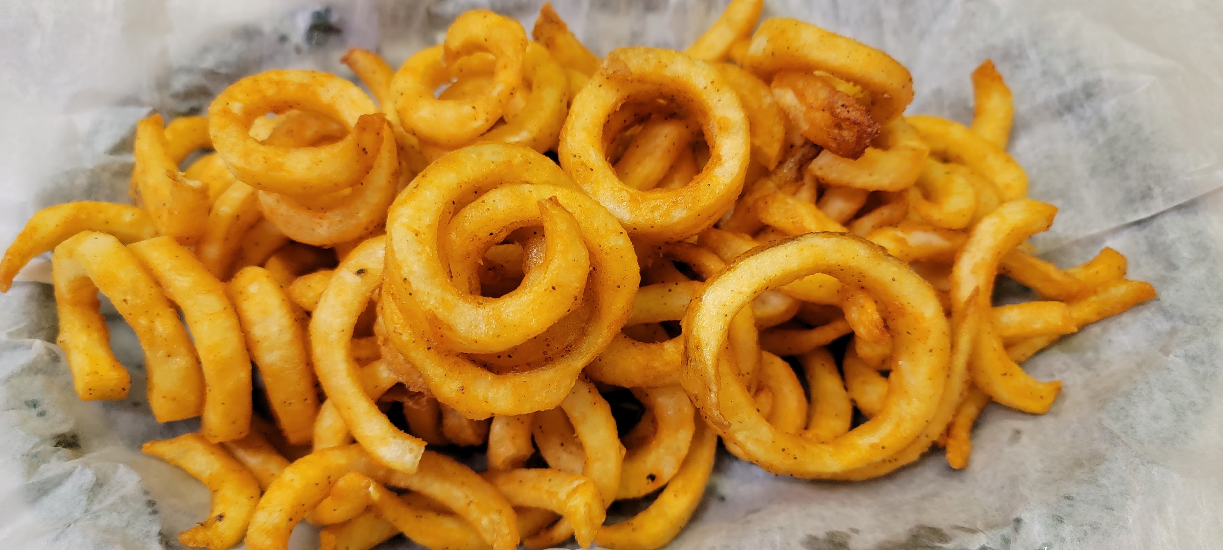Order Curly Fries food online from Mike Famous Steaks & Subs store, Newark on bringmethat.com