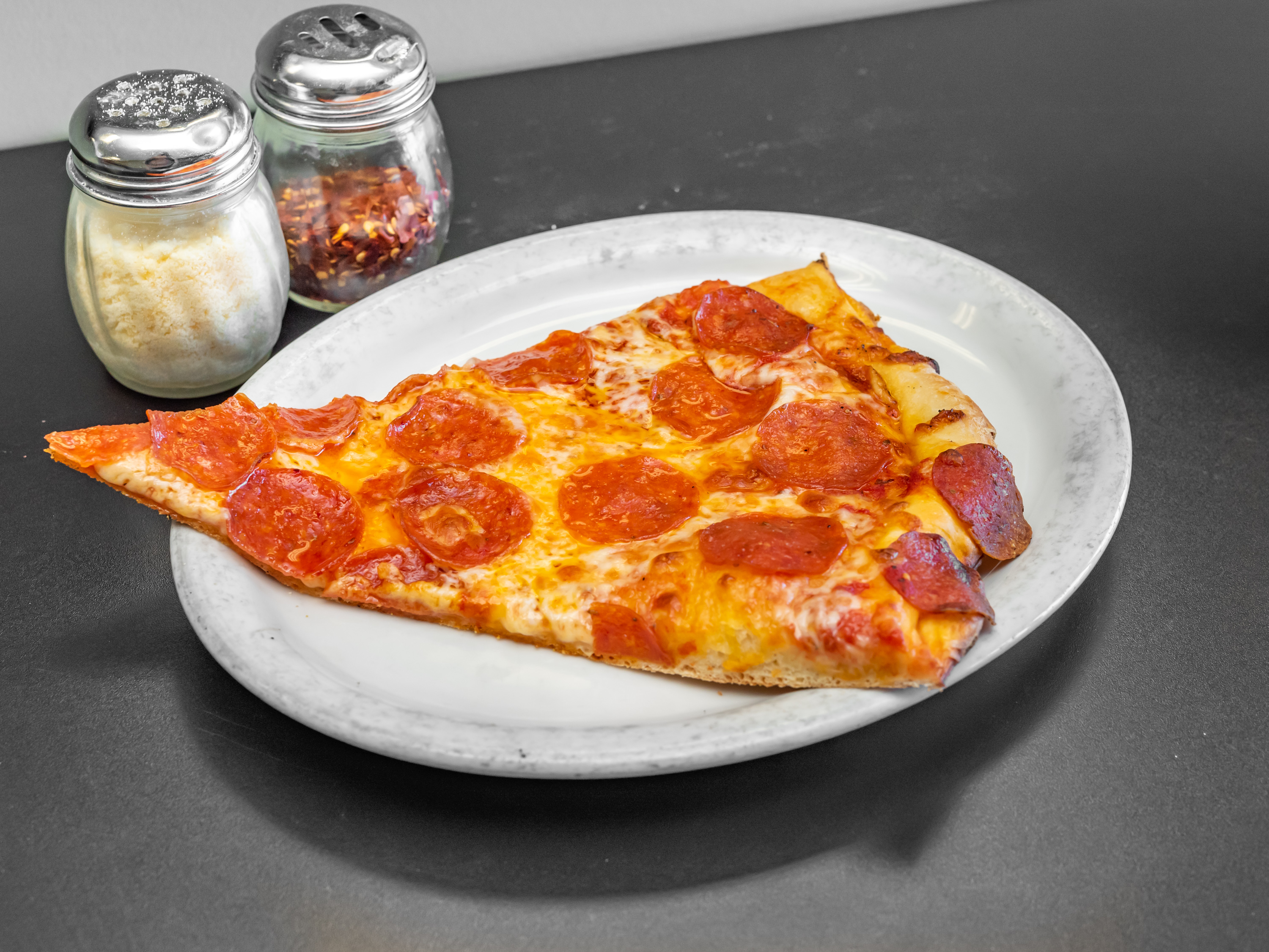 Order Pepperoni Pizza Slice food online from Tonti's Pizzeria store, Parker on bringmethat.com