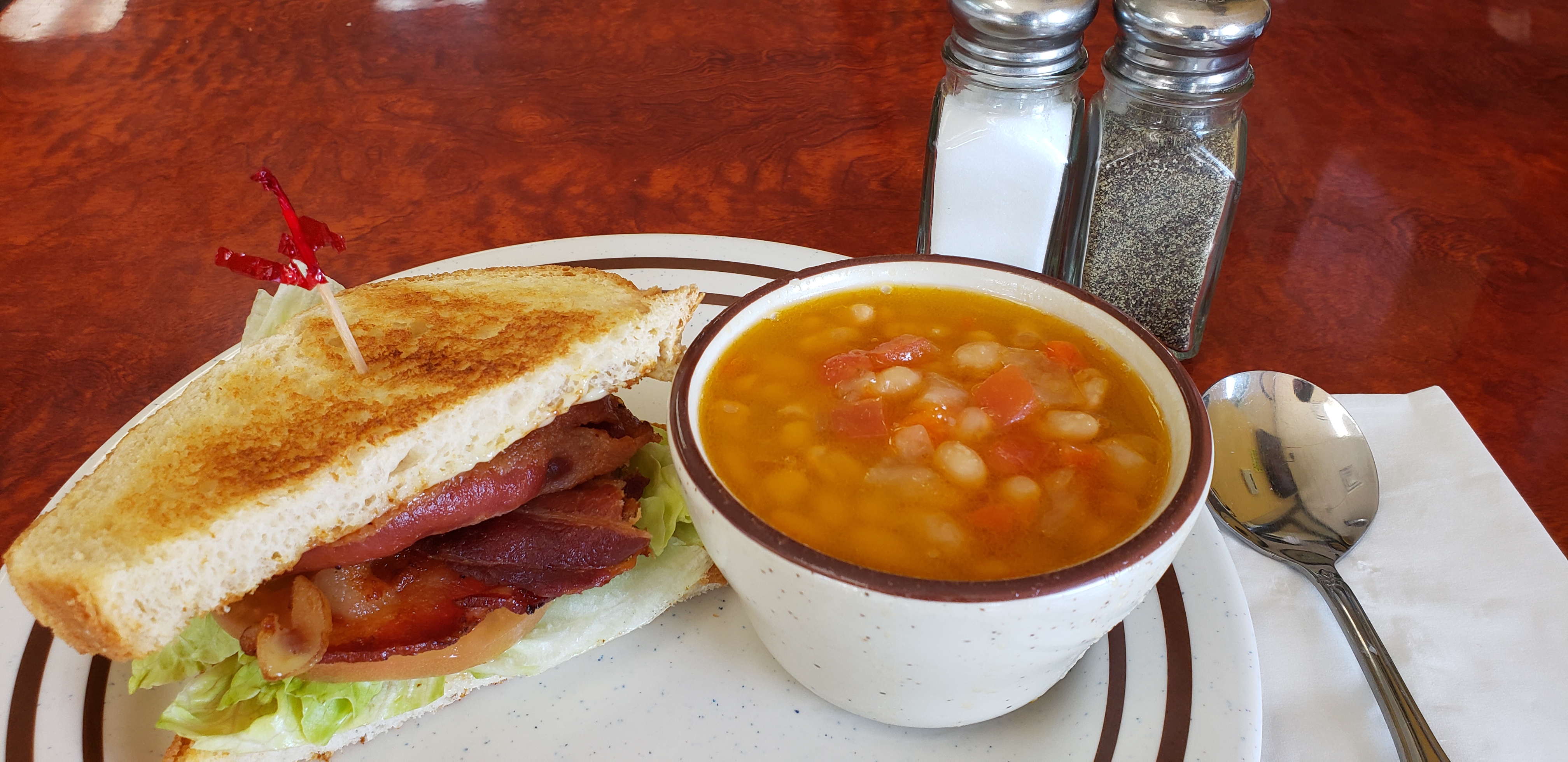 Order Cup of soup and 1/2 sandwich food online from Breakfast Cafe store, Oak Park on bringmethat.com
