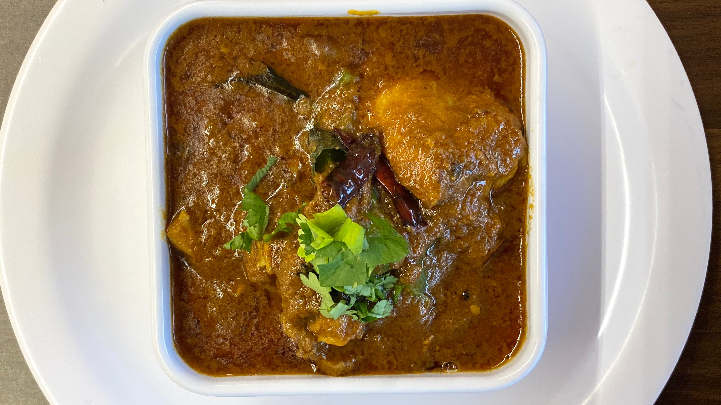 Order Kadai Chicken food online from Indian Cafe store, East Moline on bringmethat.com