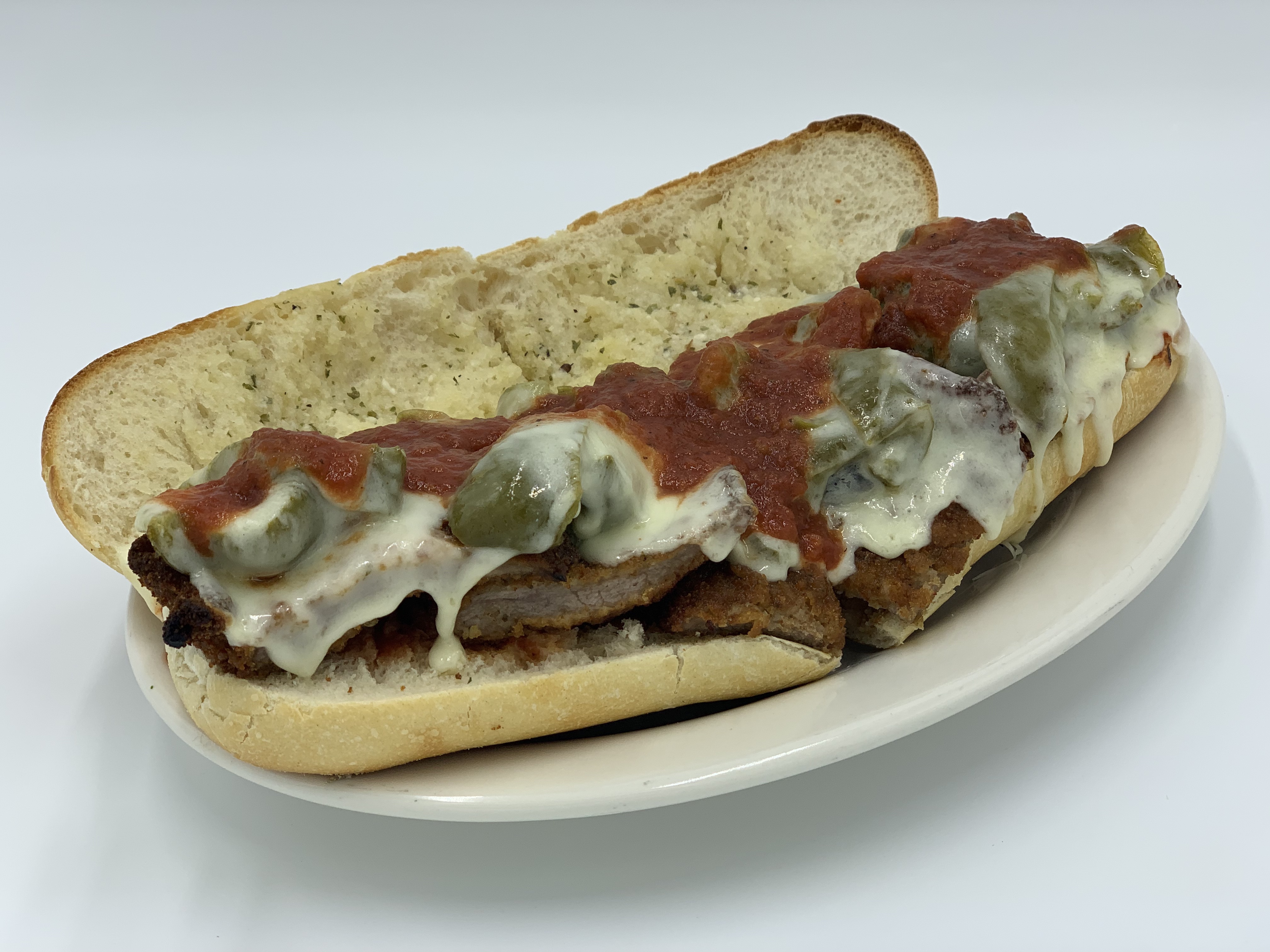 Order Veal Cutlet and Peppers Parmigiana Sandwich food online from Mario's Pizzeria of Seaford store, Seaford on bringmethat.com