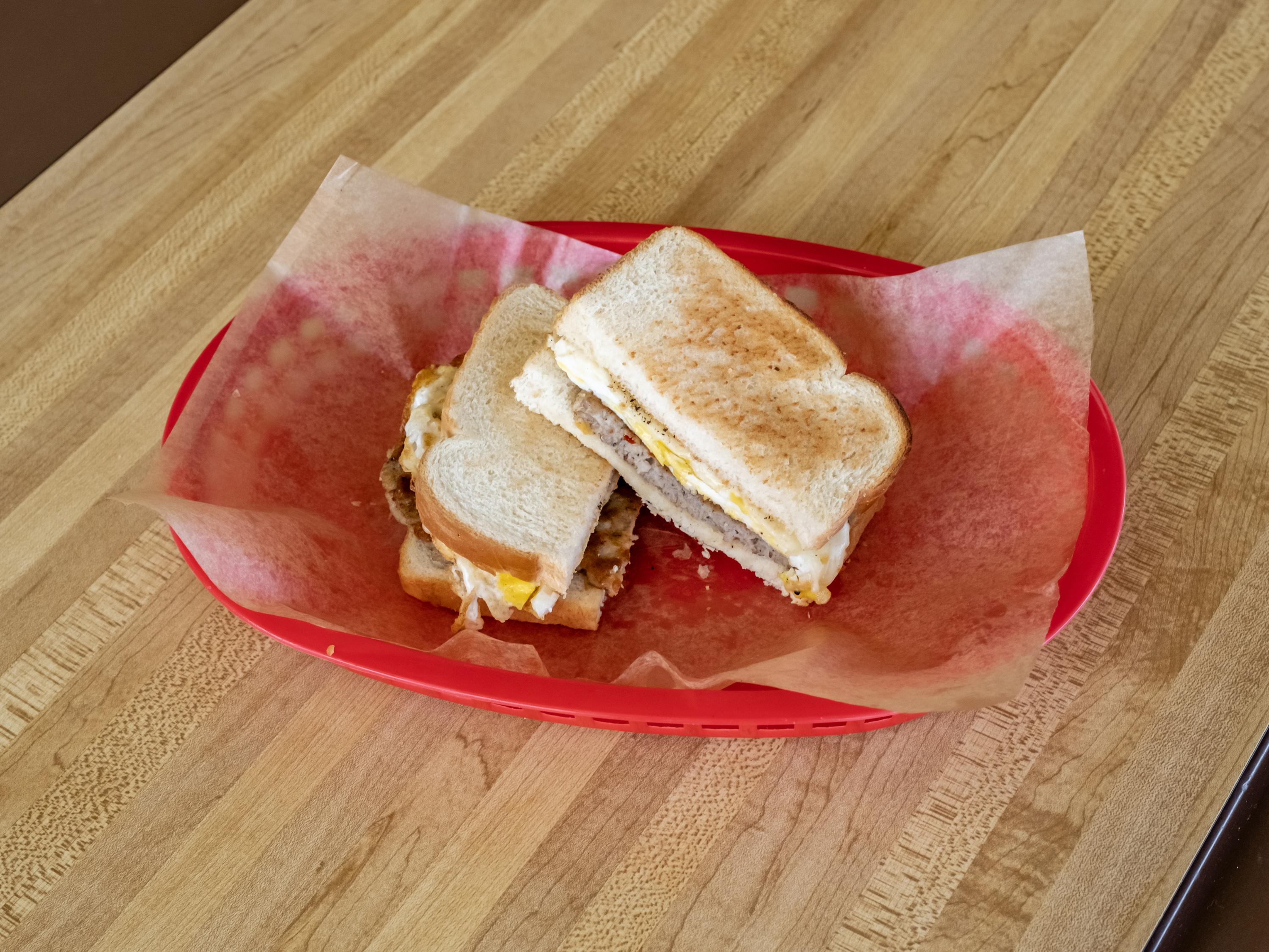 Order #14. Sausage, Egg and cheese. Toast  food online from Donut Plus store, Orange on bringmethat.com