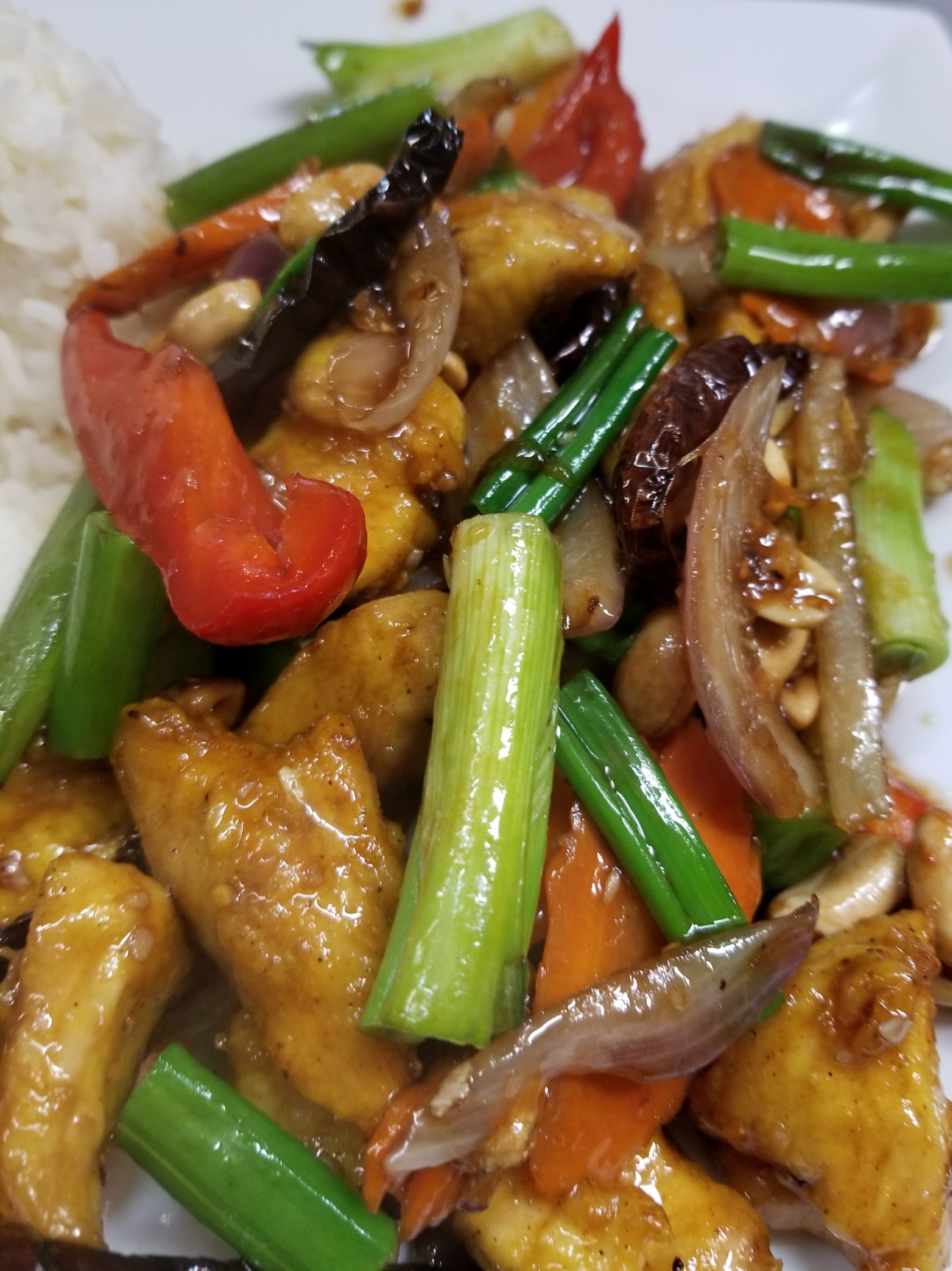 Order 55. Kung Pao Chicken food online from Sticky Rice Restaurant store, Modesto on bringmethat.com