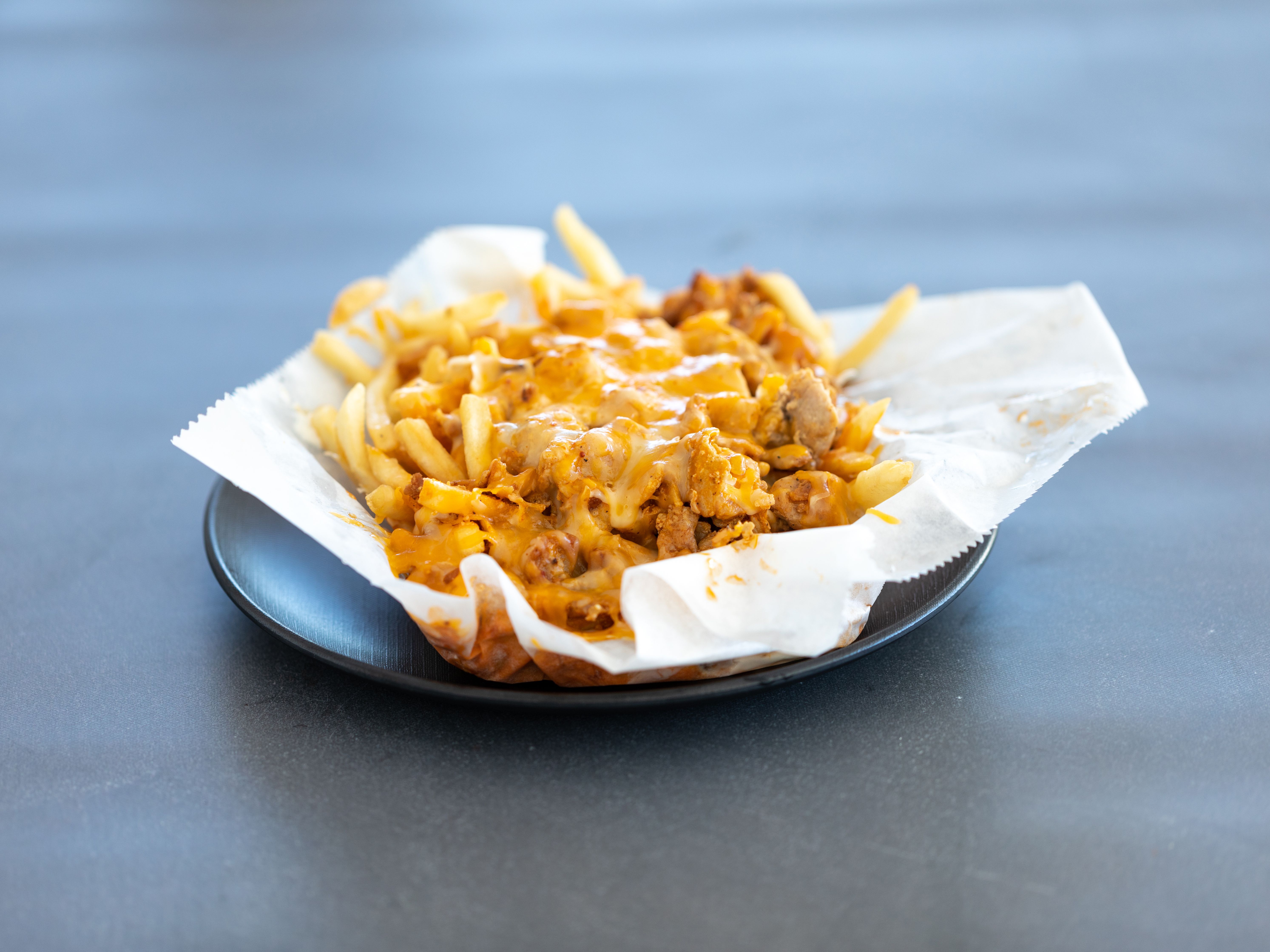 Order * Buffalo Fries food online from Burros & Fries store, Escondido on bringmethat.com