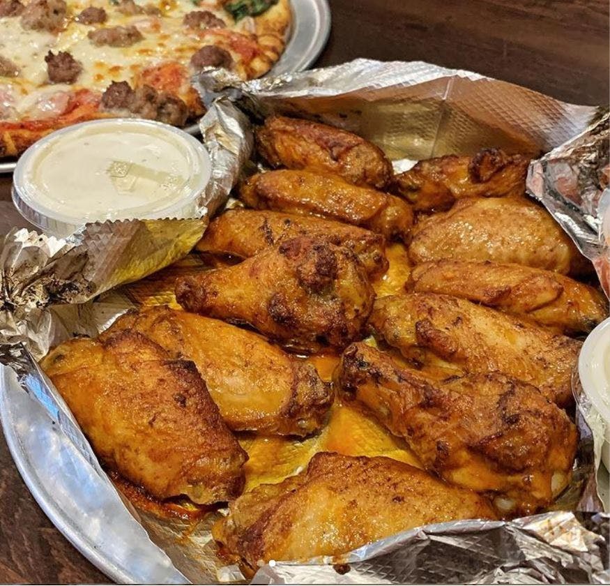 Order Hot Wings - 12 Pieces food online from Parkway Pizza NE store, Minneapolis on bringmethat.com